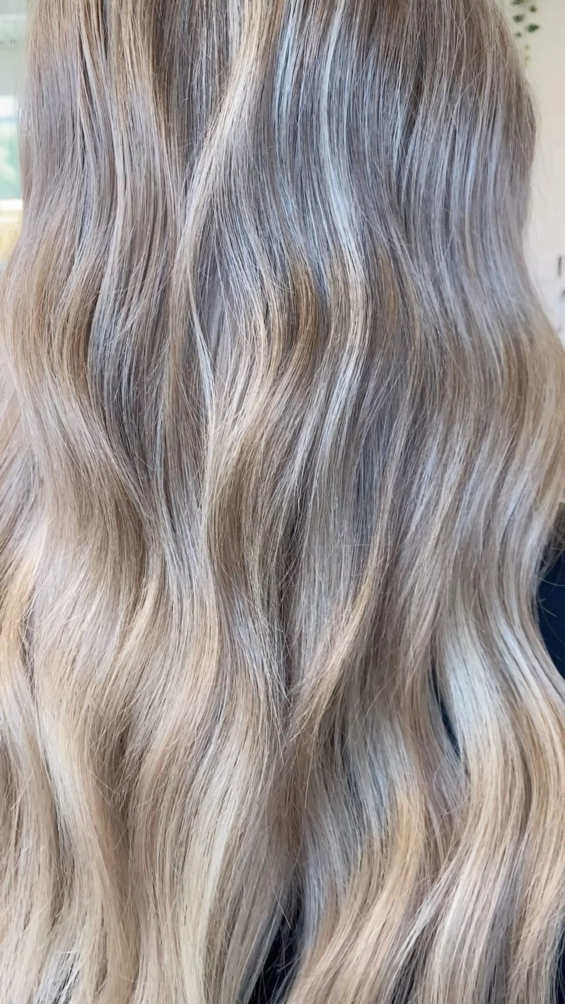 Long beige blonde hair with soft, textured waves and seamless blending. 1