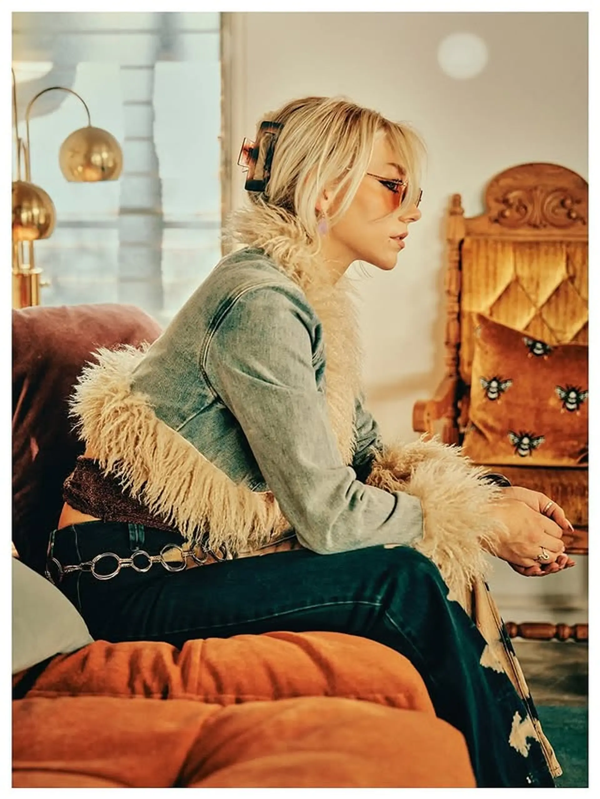 A trendy platinum blonde blunt bob, styled with a claw clip for a 90s chic look. 1