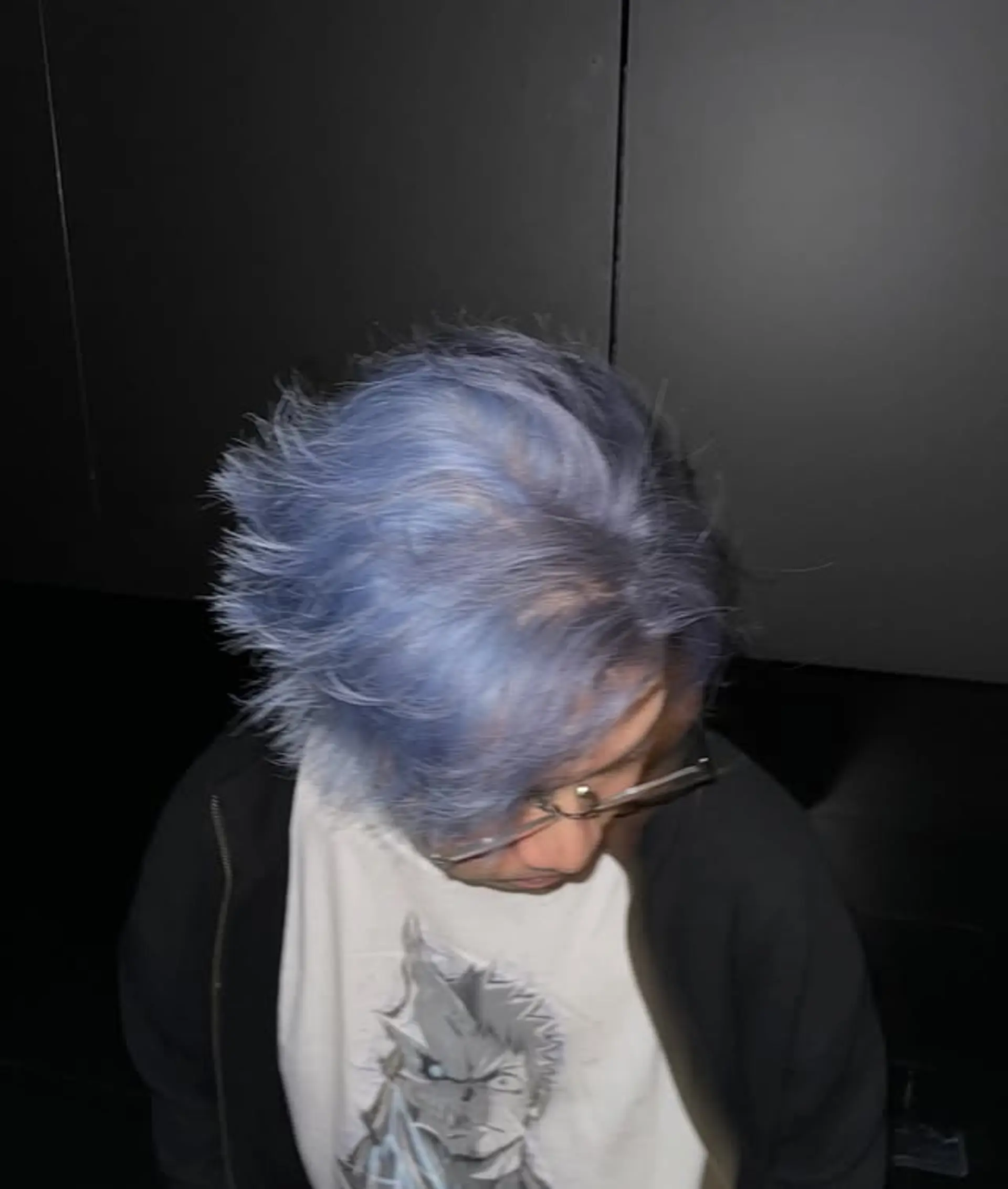 A short, spiky haircut with a vibrant electric blue (periwinkle) color, offering a bold and textured look that stands out. 1