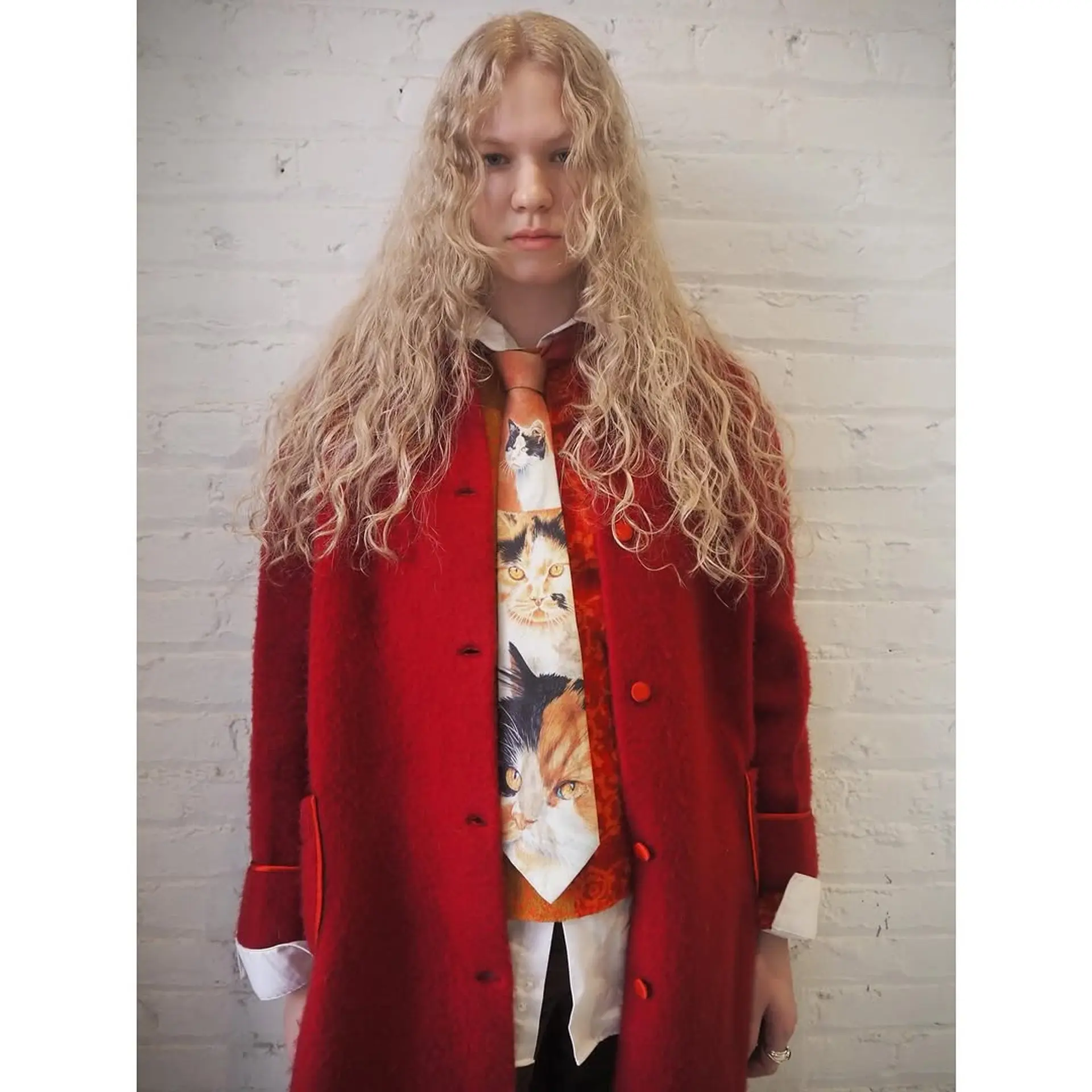 Long, blonde hair styled into loose, romantic waves. 1