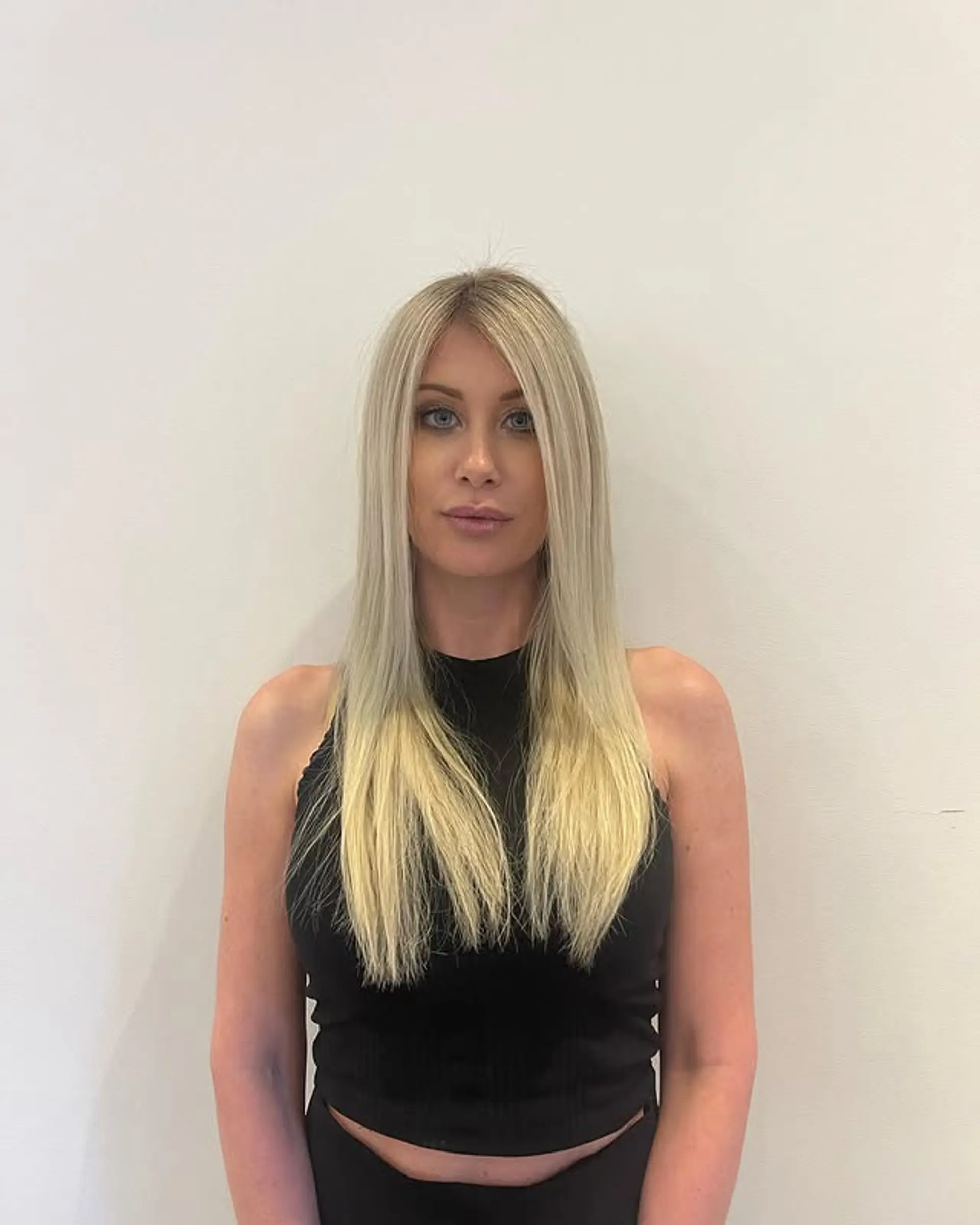 A chic medium-length straight hairstyle with a beautiful platinum icy blonde balayage. 1