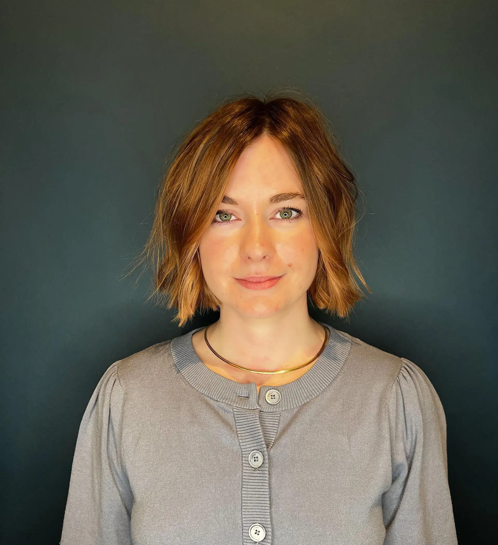 A short, shaggy bob with textured layers and subtle highlights. 1