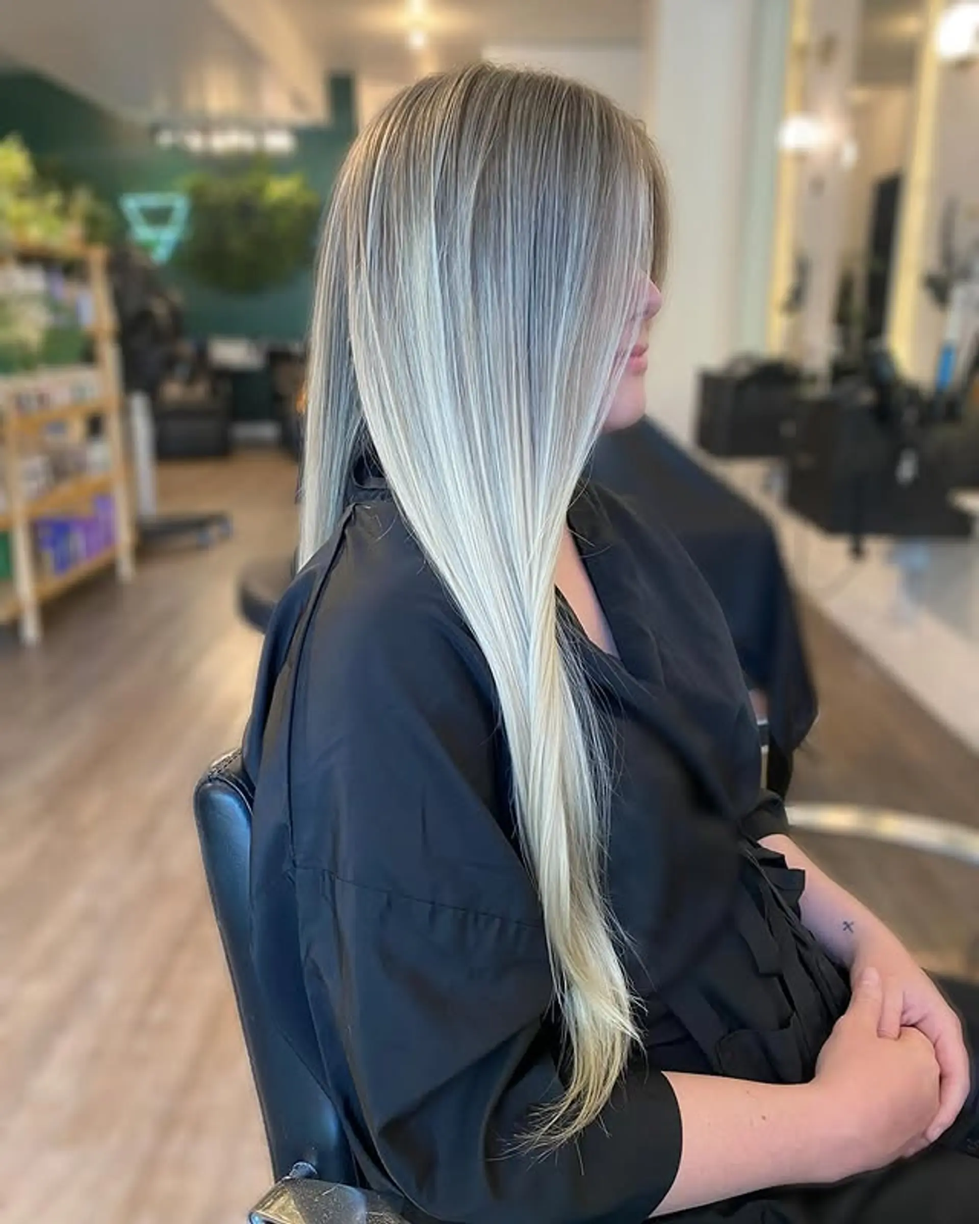 A sleek and modern very long straight hairstyle featuring an icy blonde balayage with ash blonde tones. 1