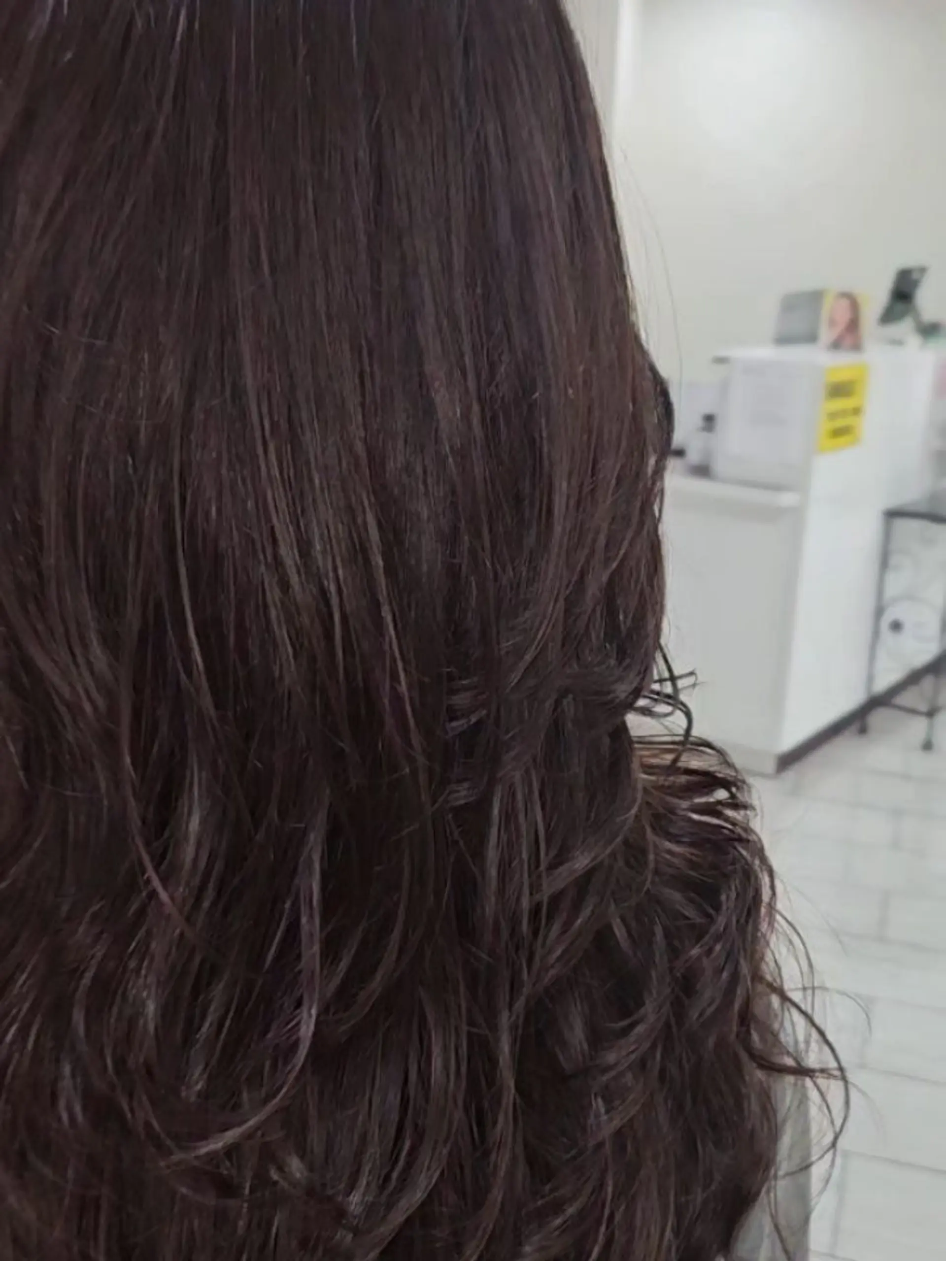 Long dark layered hair featuring loose, textured waves and soft body throughout. 1