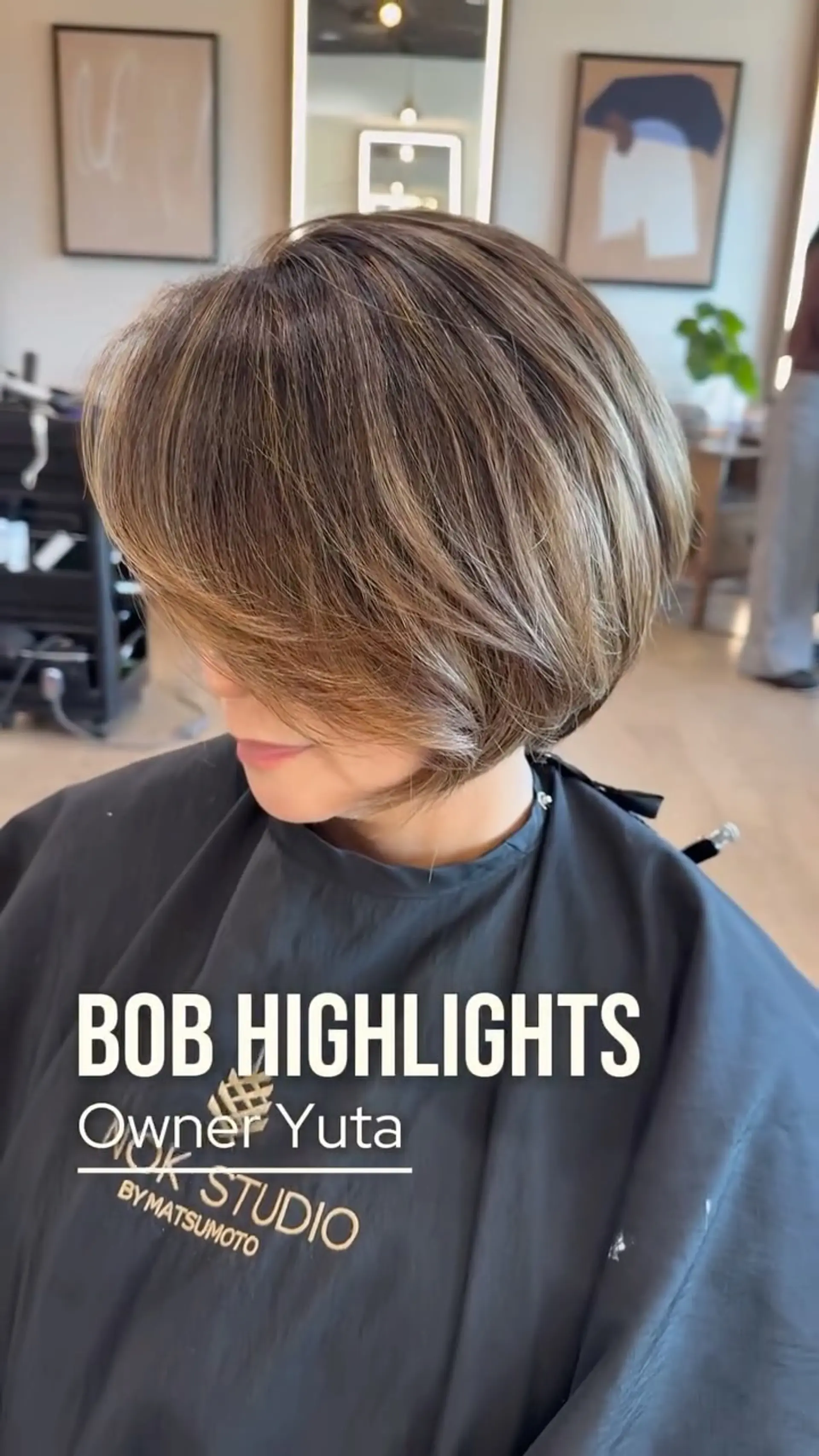 A textured short bob haircut featuring fine multidimensional highlights and soft face-framing layers. 1