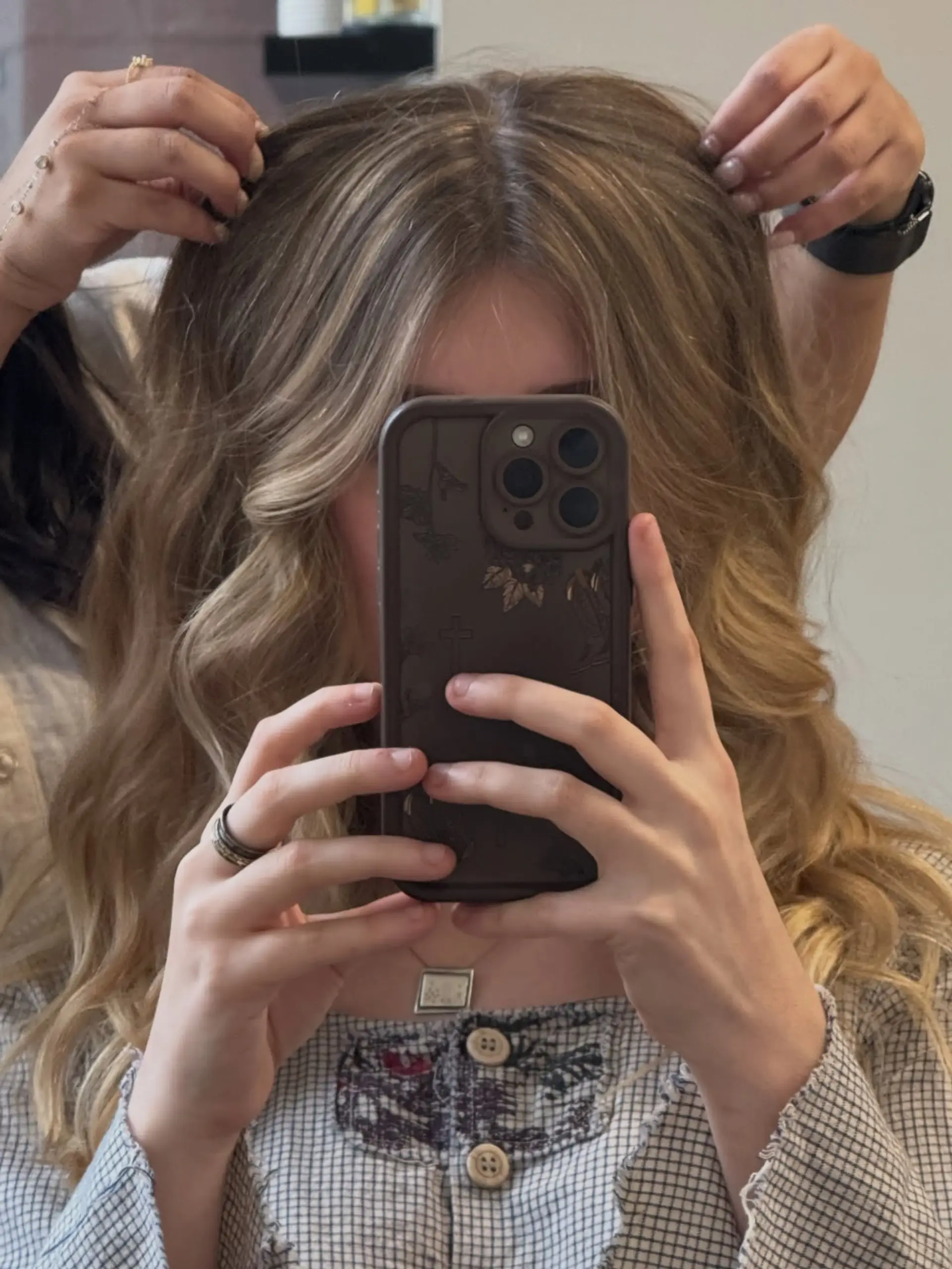 Long wavy honey blonde hair featuring seamless dimensional highlights, face-framing curtain bangs, and soft layers. 1