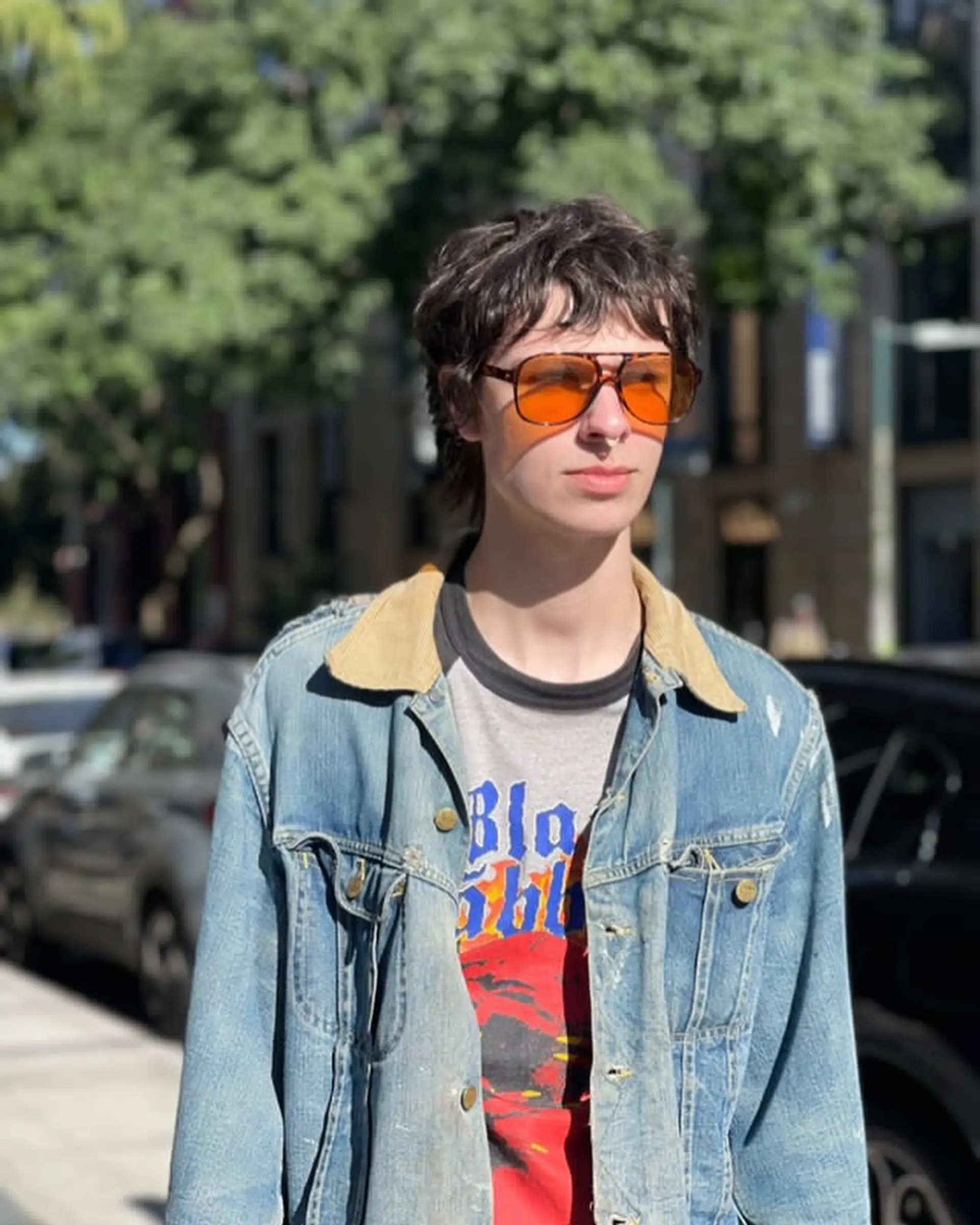 A medium-length, dark brown hairstyle with shaggy layers, choppy ends, and a casual tousled texture with a slight fringe. 2
