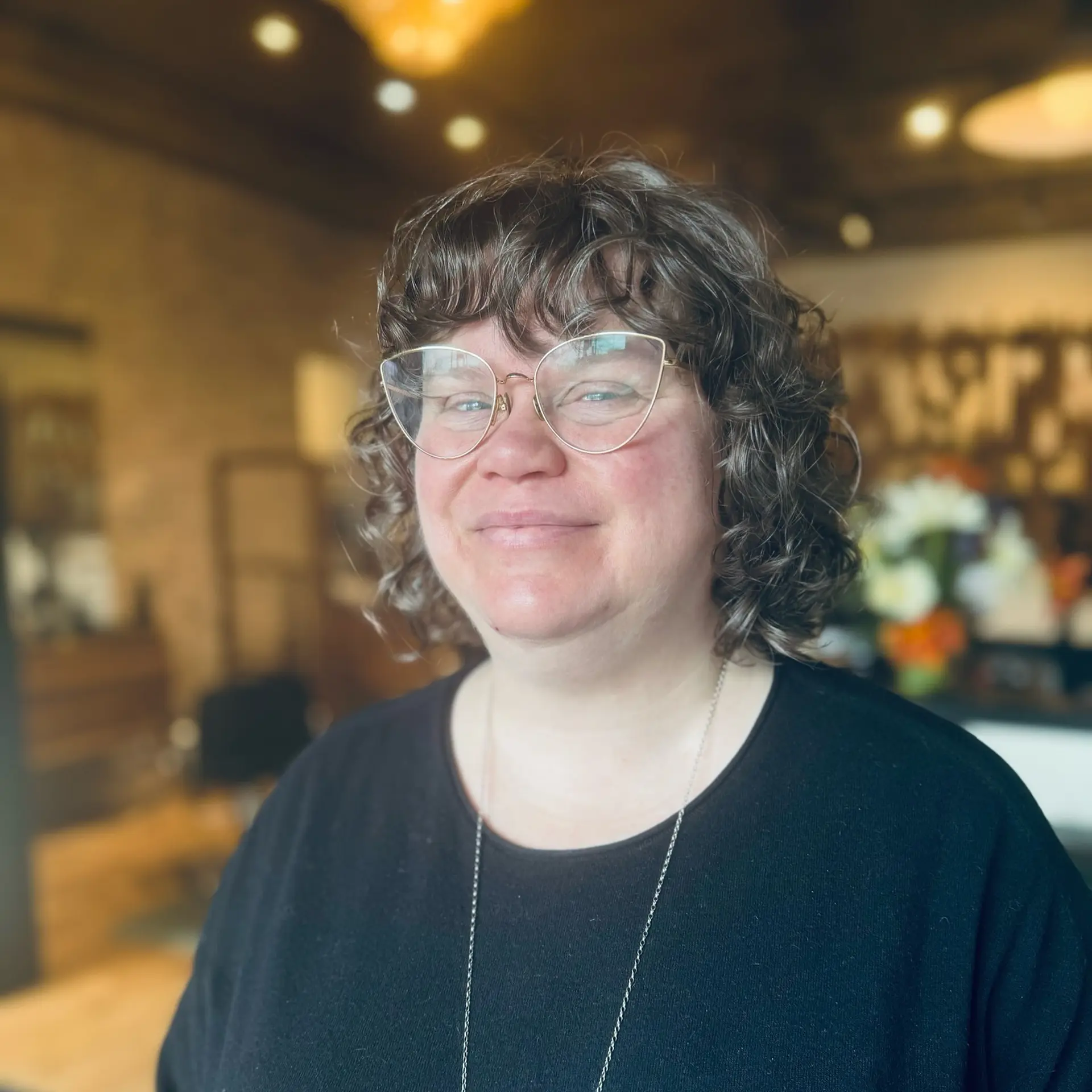 A shaggy, curly bob with short bangs, creating a textured and effortless look. 1