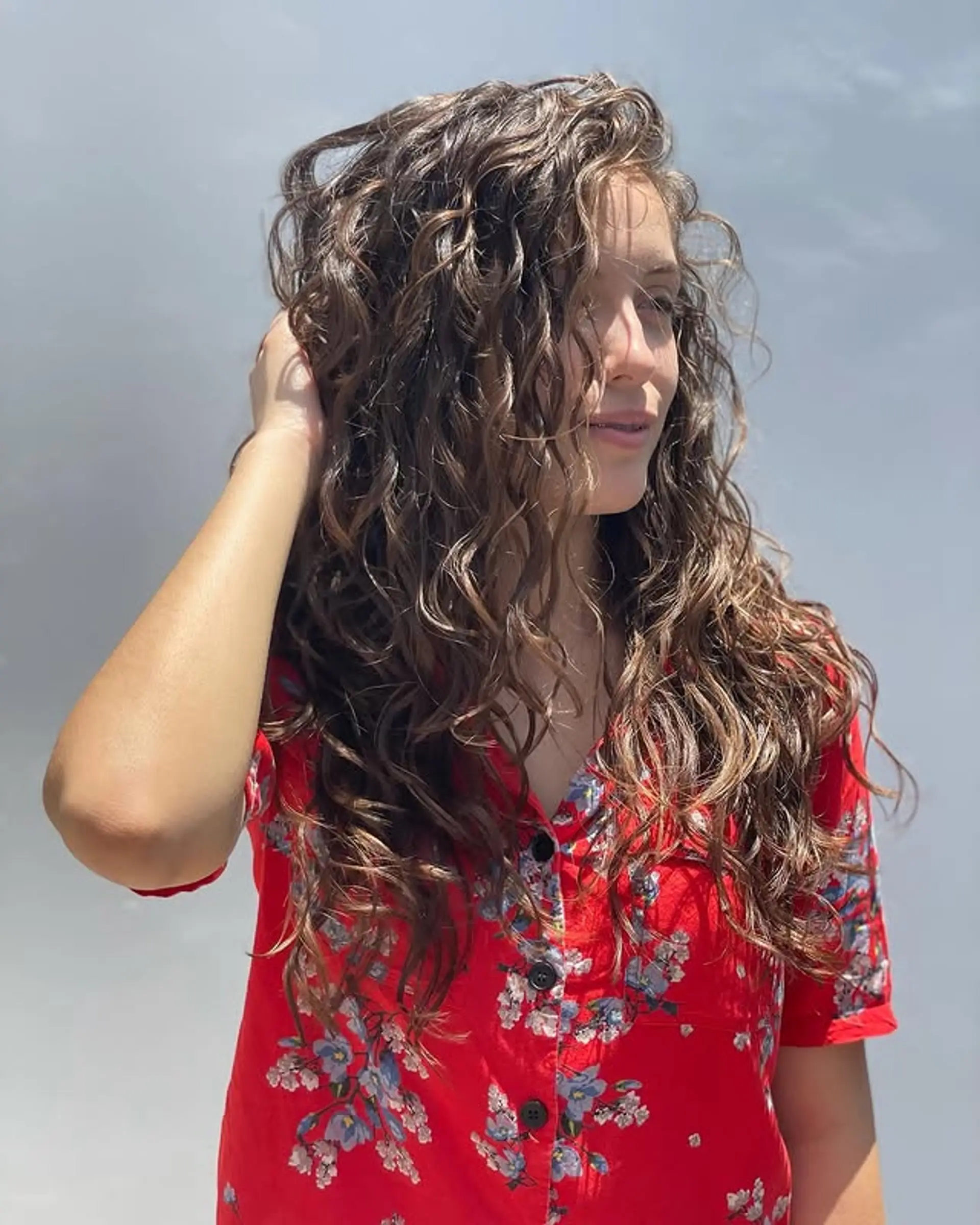 Long, natural curly hair with dimensional color. 1