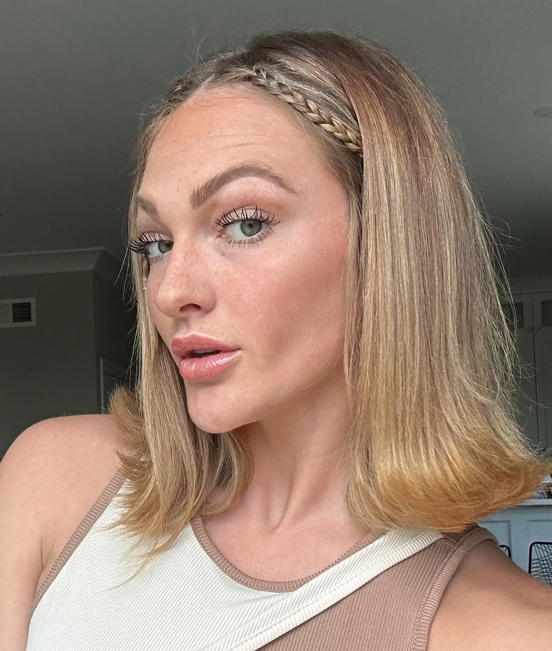 A trendy medium-length bob with a charming braided headband detail. 1