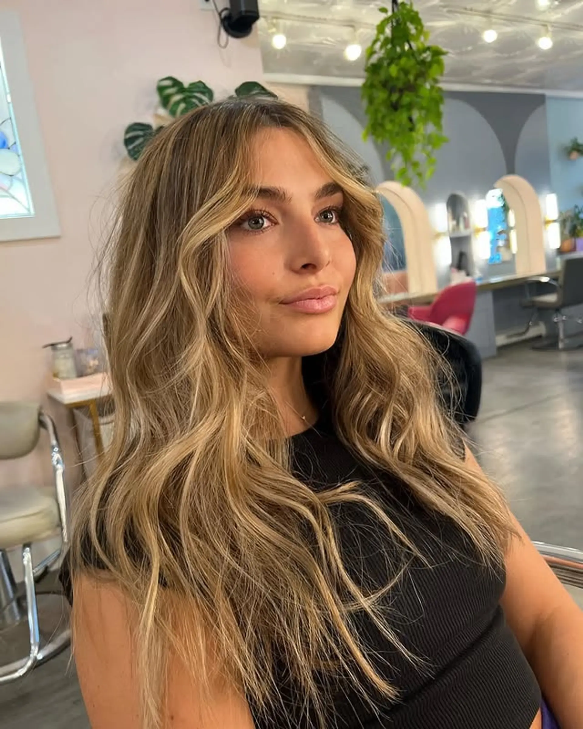 A medium-length wavy hairstyle with a bronde balayage. 1