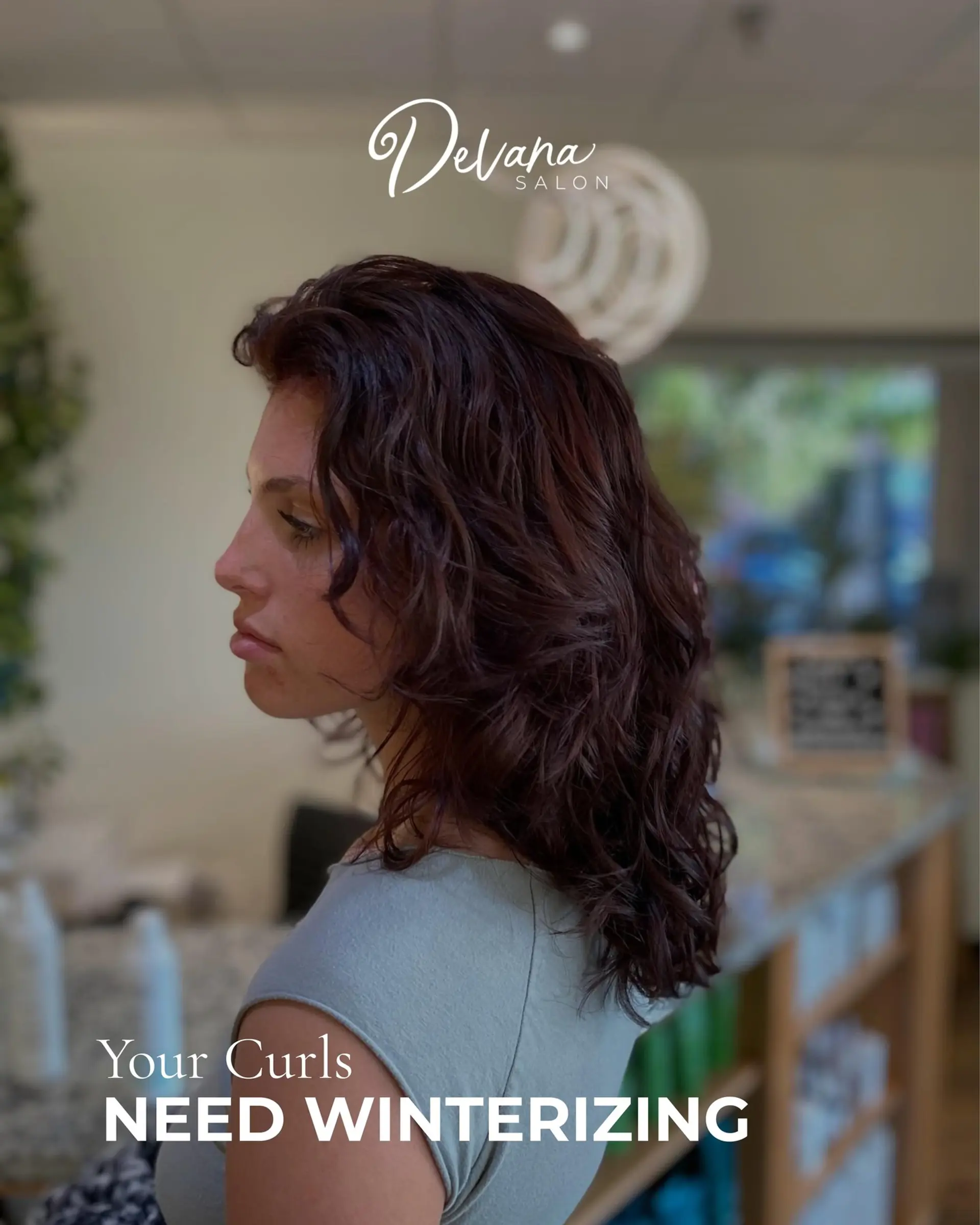 Medium-length layered curly hairstyle in a rich deep brunette tone. 1