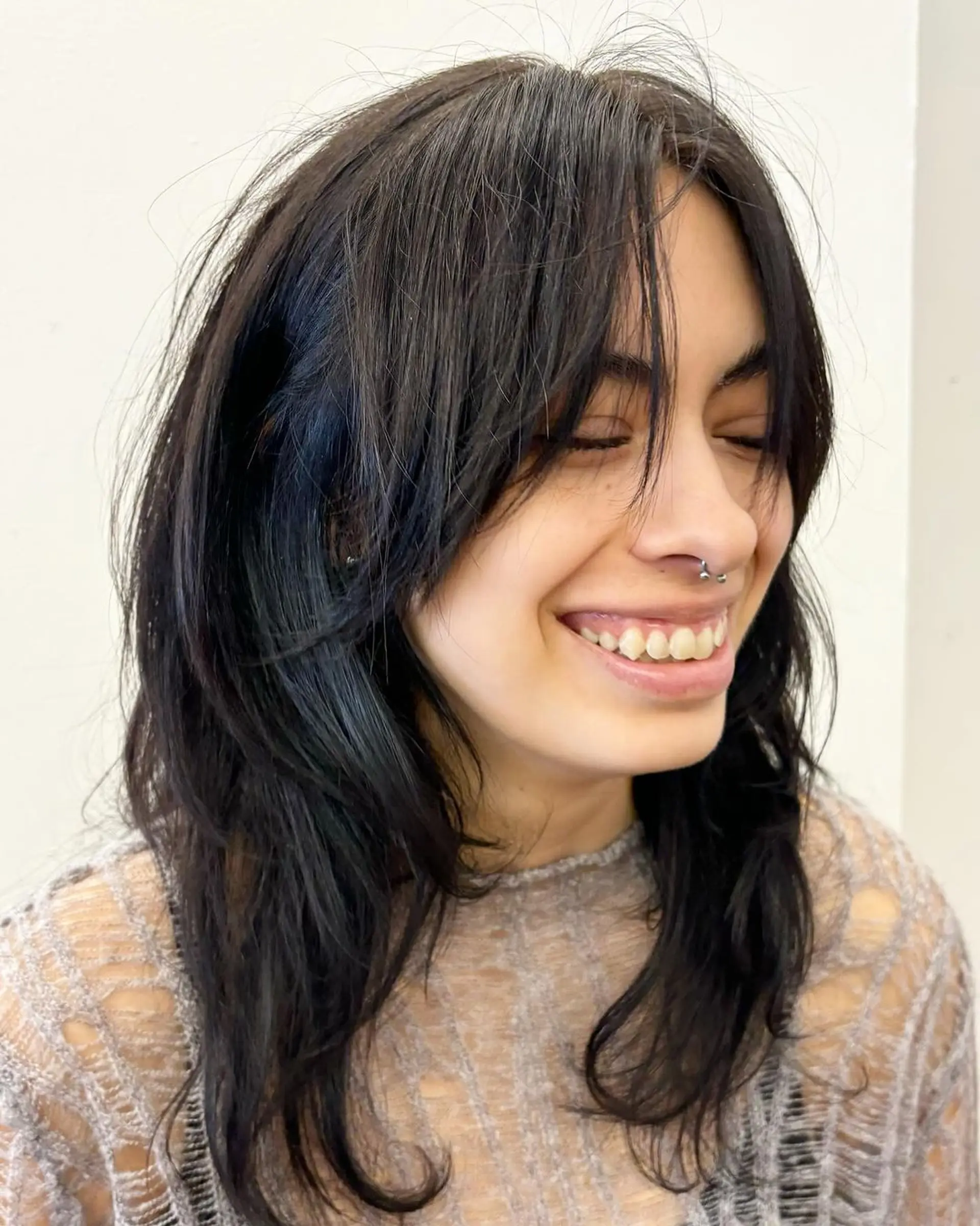 Medium-length, straight black hair with soft layers and a side-swept fringe that frames the face, offering a natural, casual look. Haircut by @takeohair 3