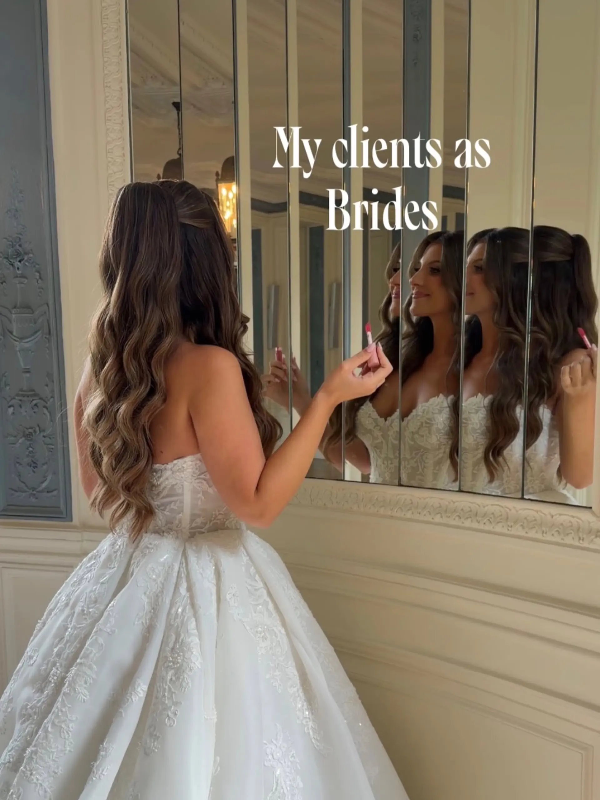 A romantic bridal half-up style featuring cascading voluminous waves and soft dimensional color. 1
