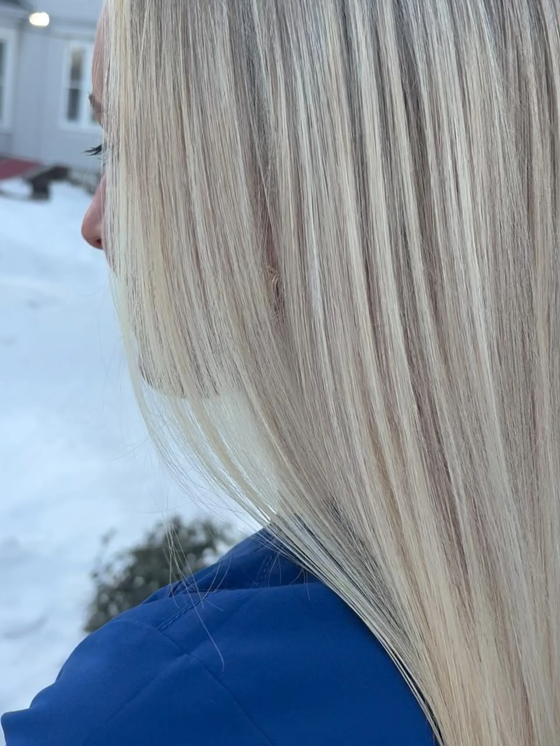 Long, silky-smooth straight hair featuring bright platinum blonde highlights with seamless, delicate dimension. 1
