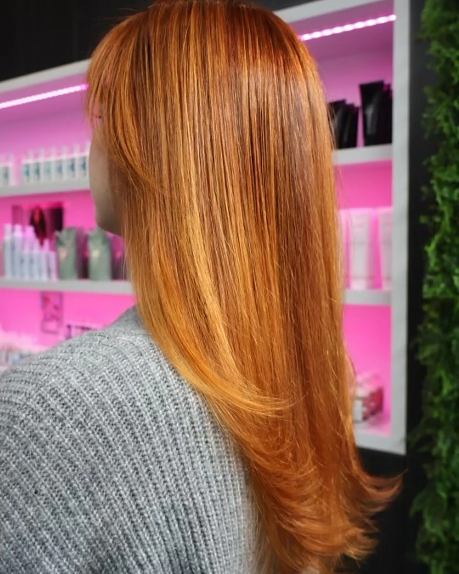 A medium-length layered haircut with bangs. 2