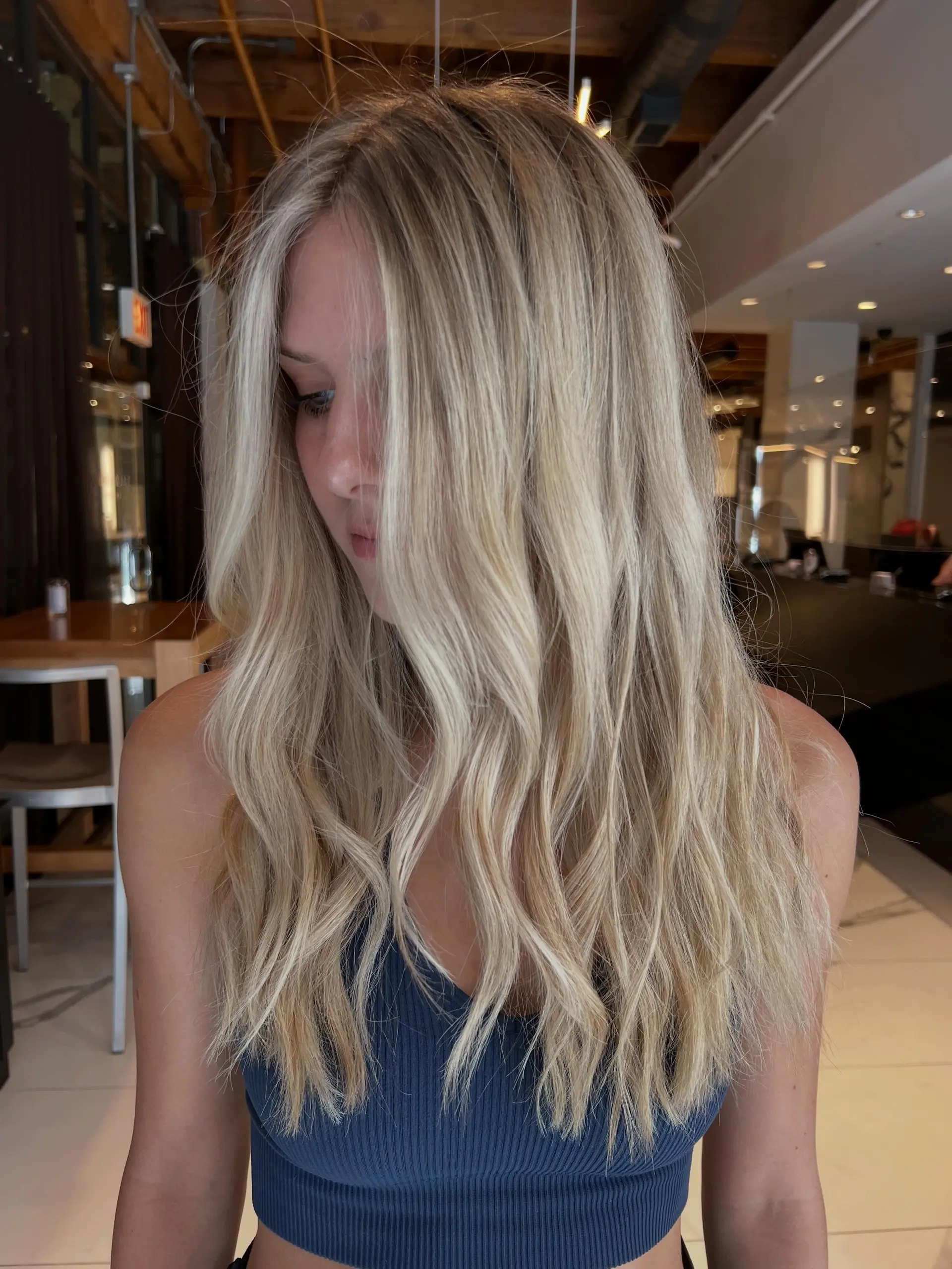 Bright blonde dimensional highlights styled into effortless, soft waves. 1