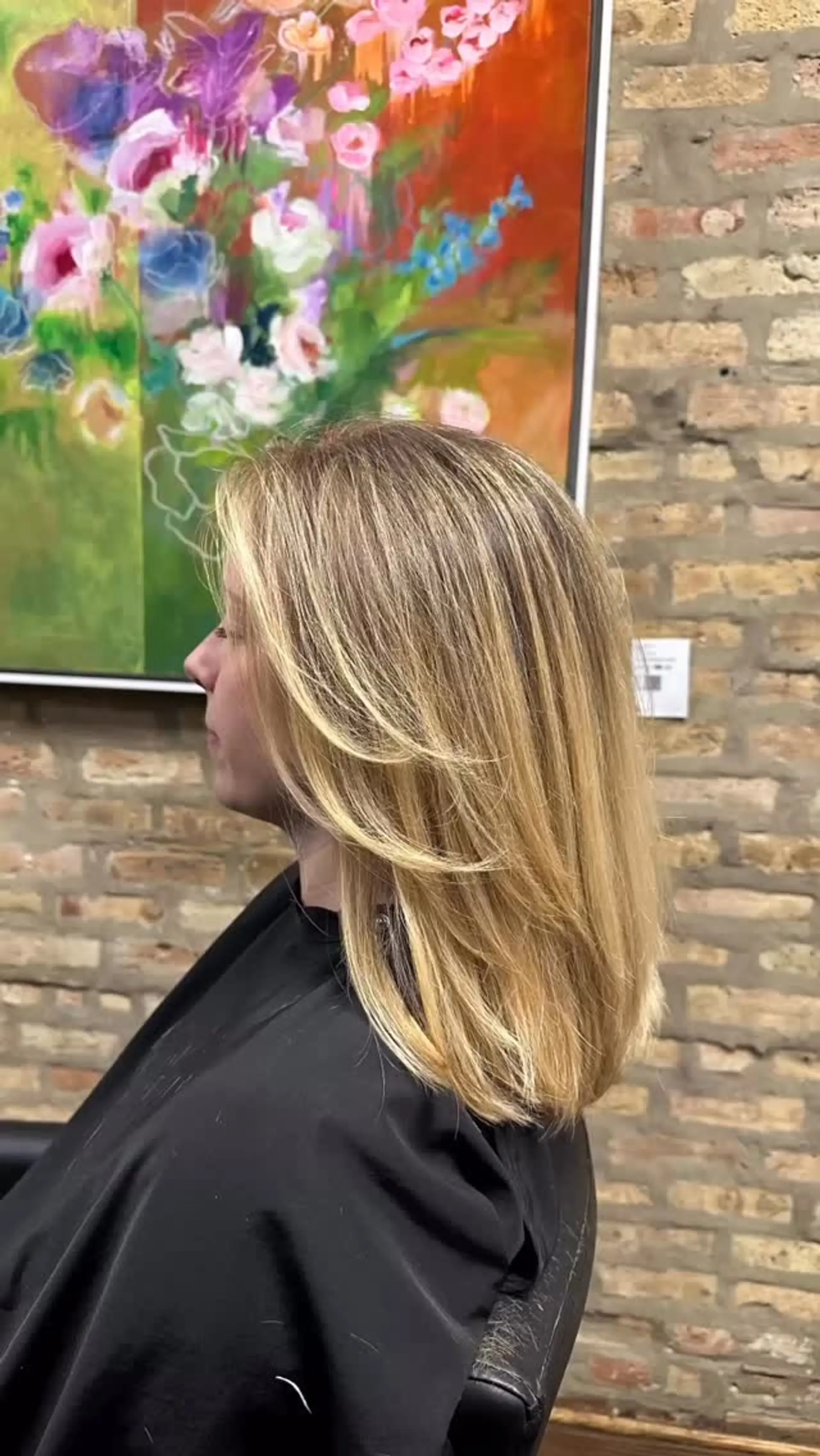 Medium-length blonde haircut with soft, textured layers and face-framing curtain pieces. 1