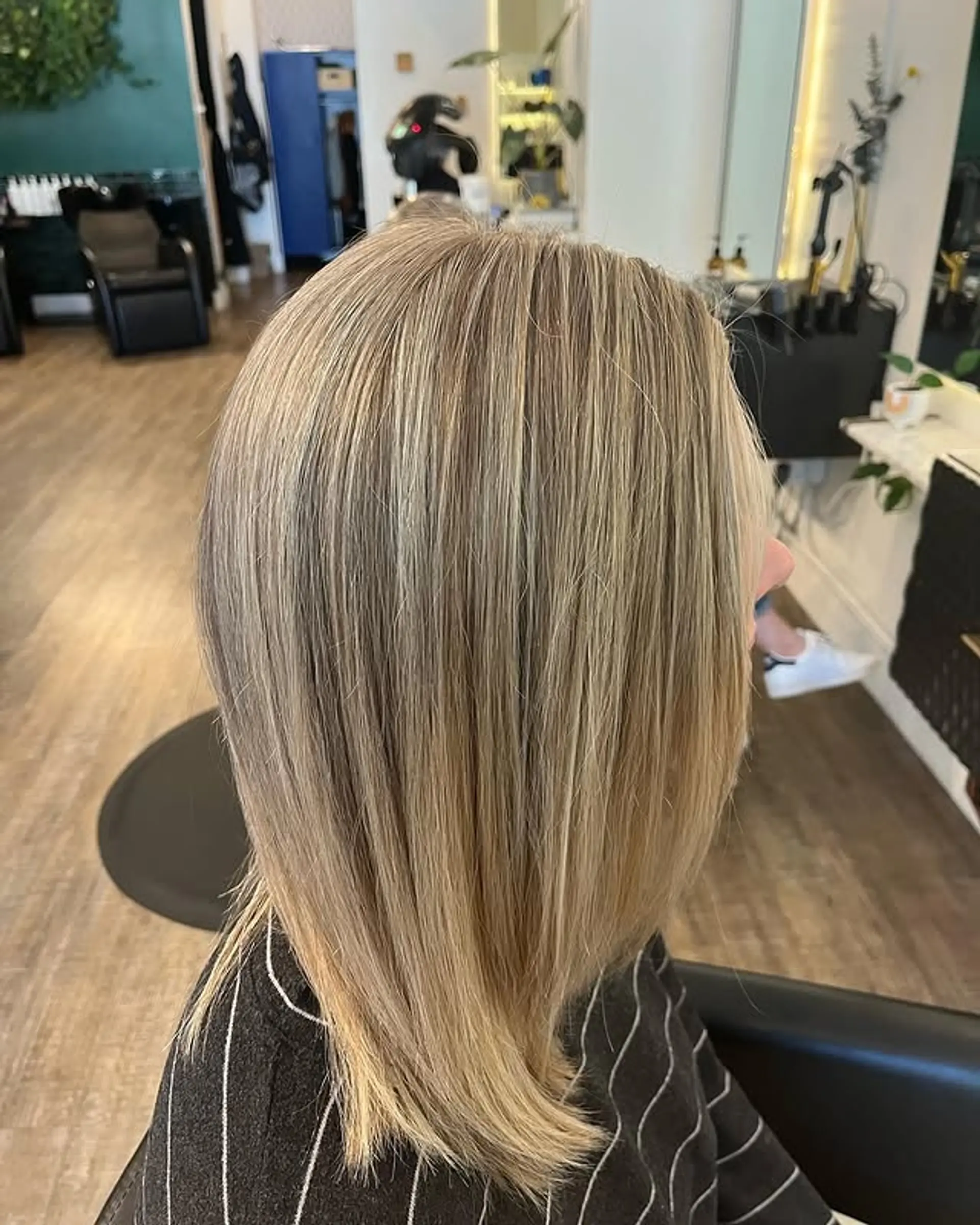 A classic blunt lob with a subtle blonde balayage. 1