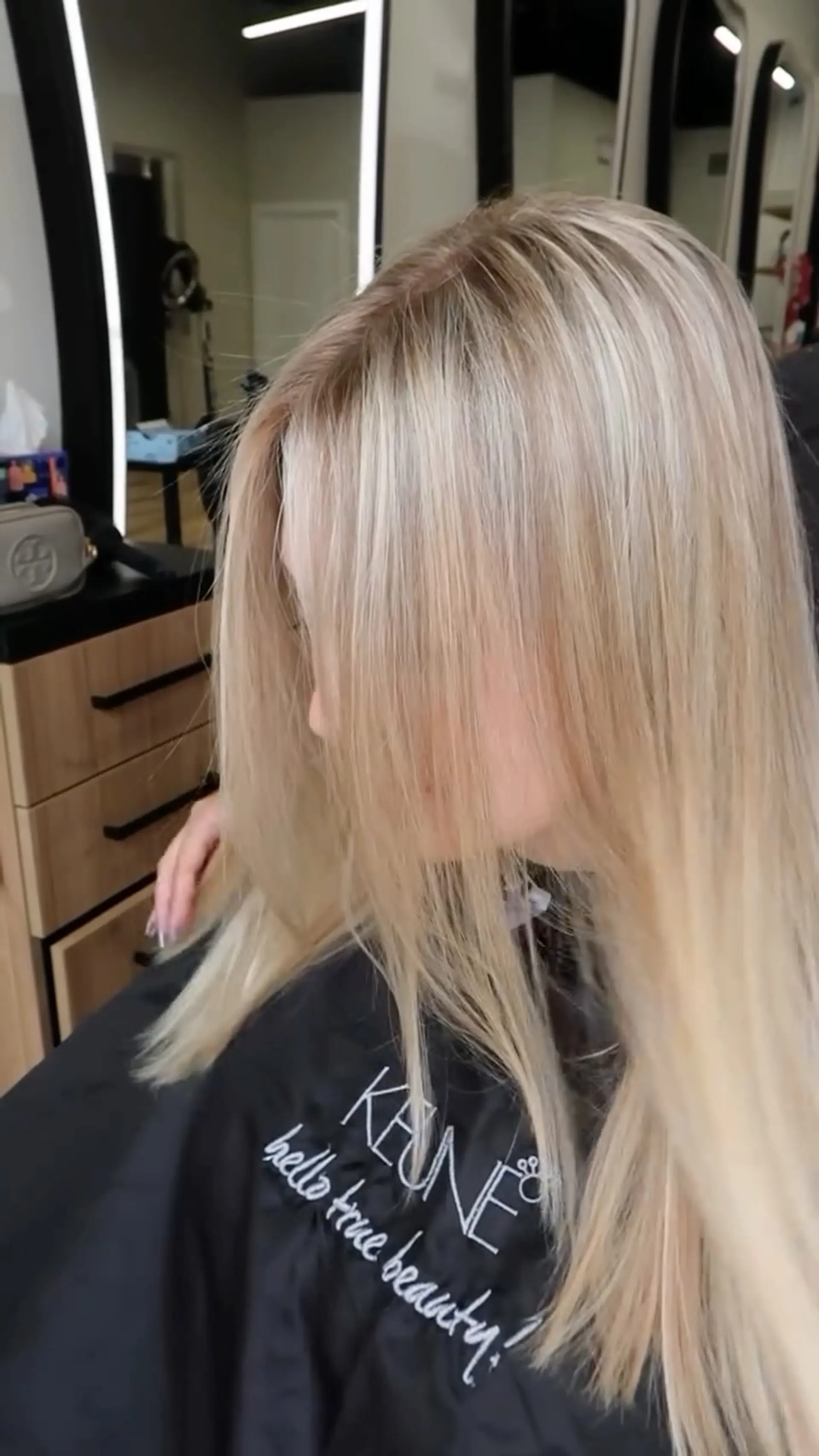 Straight long bright blonde hair with a smooth finish and a clean blonde lift. 1