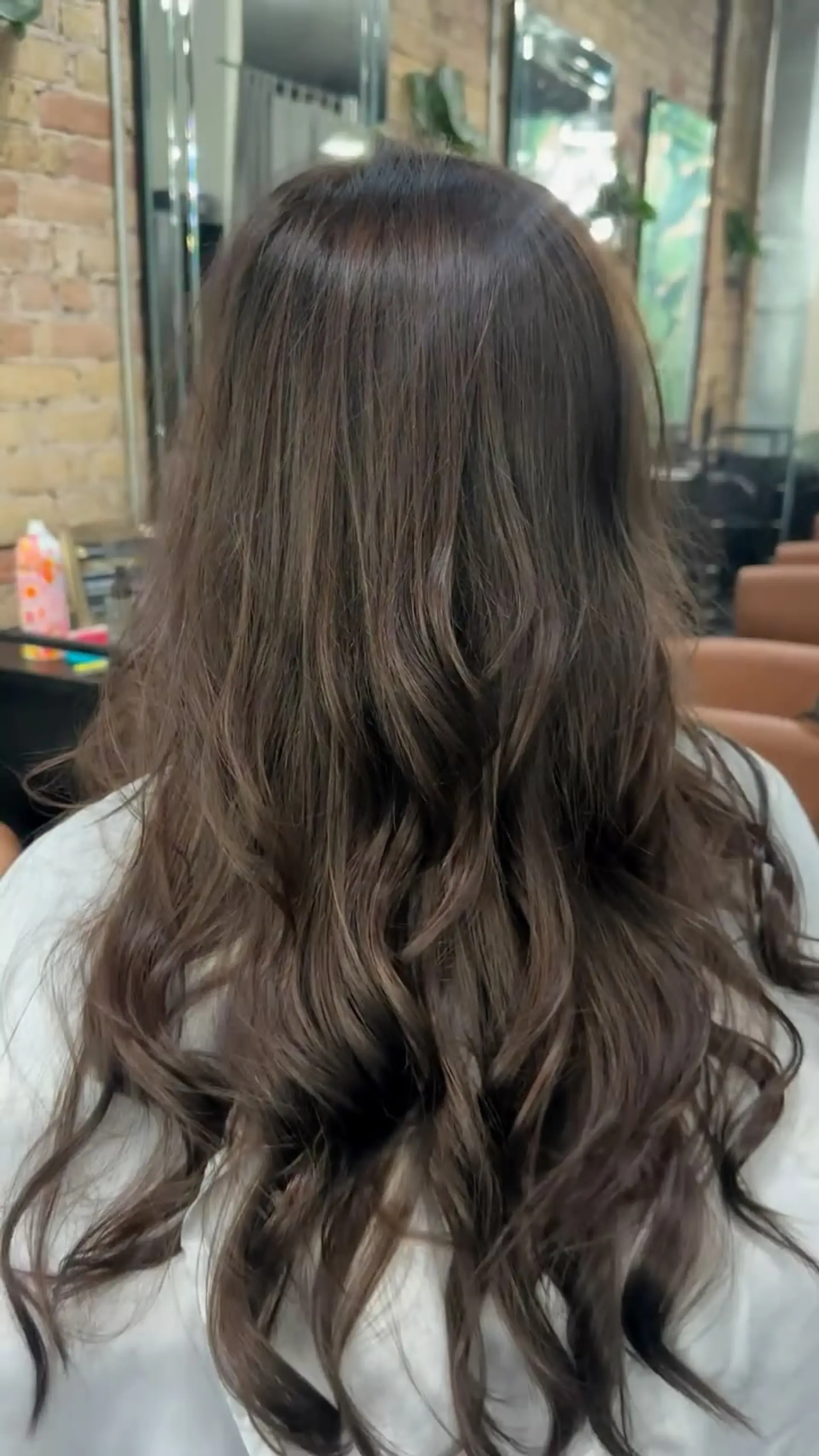 Rich, deep coffee brown long hair styled into loose, effortless waves. 1