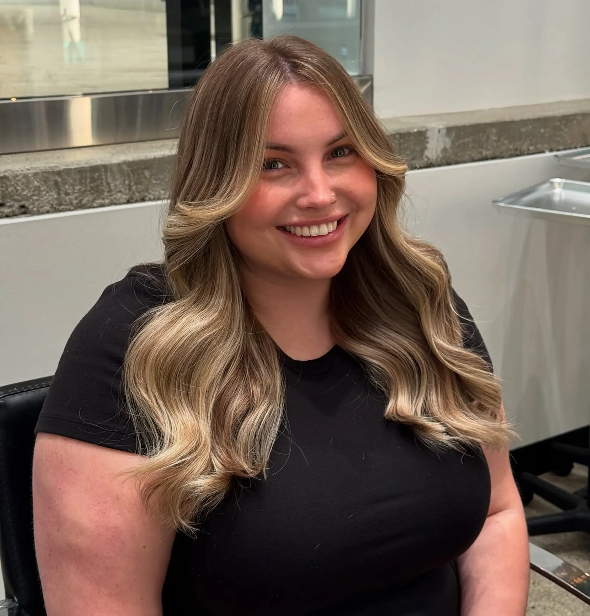 Long wavy hair with curtain bangs and face-framing layers. 1