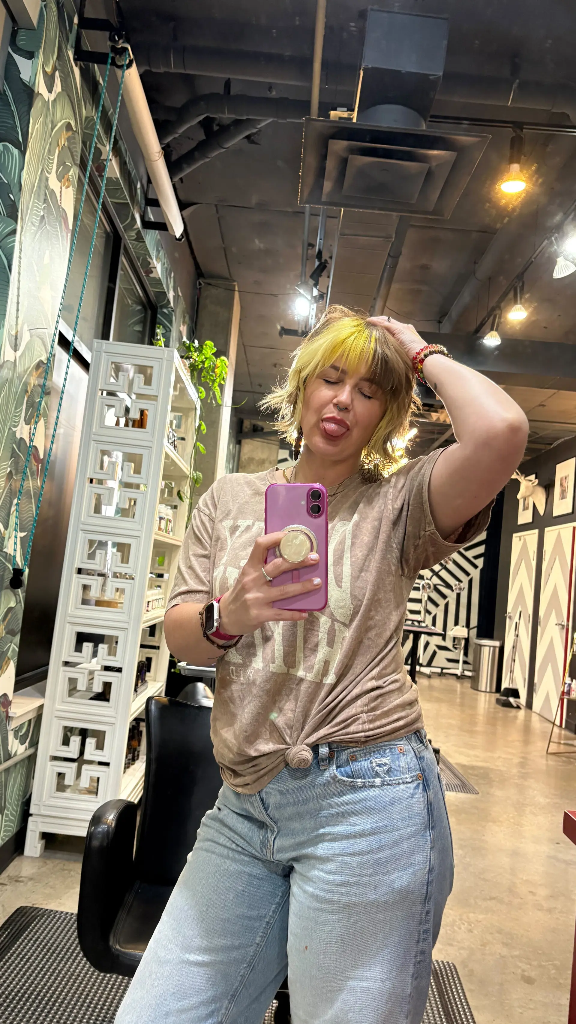 A textured shaggy bob featuring choppy bangs and a bold split-color yellow accent at the front. 1