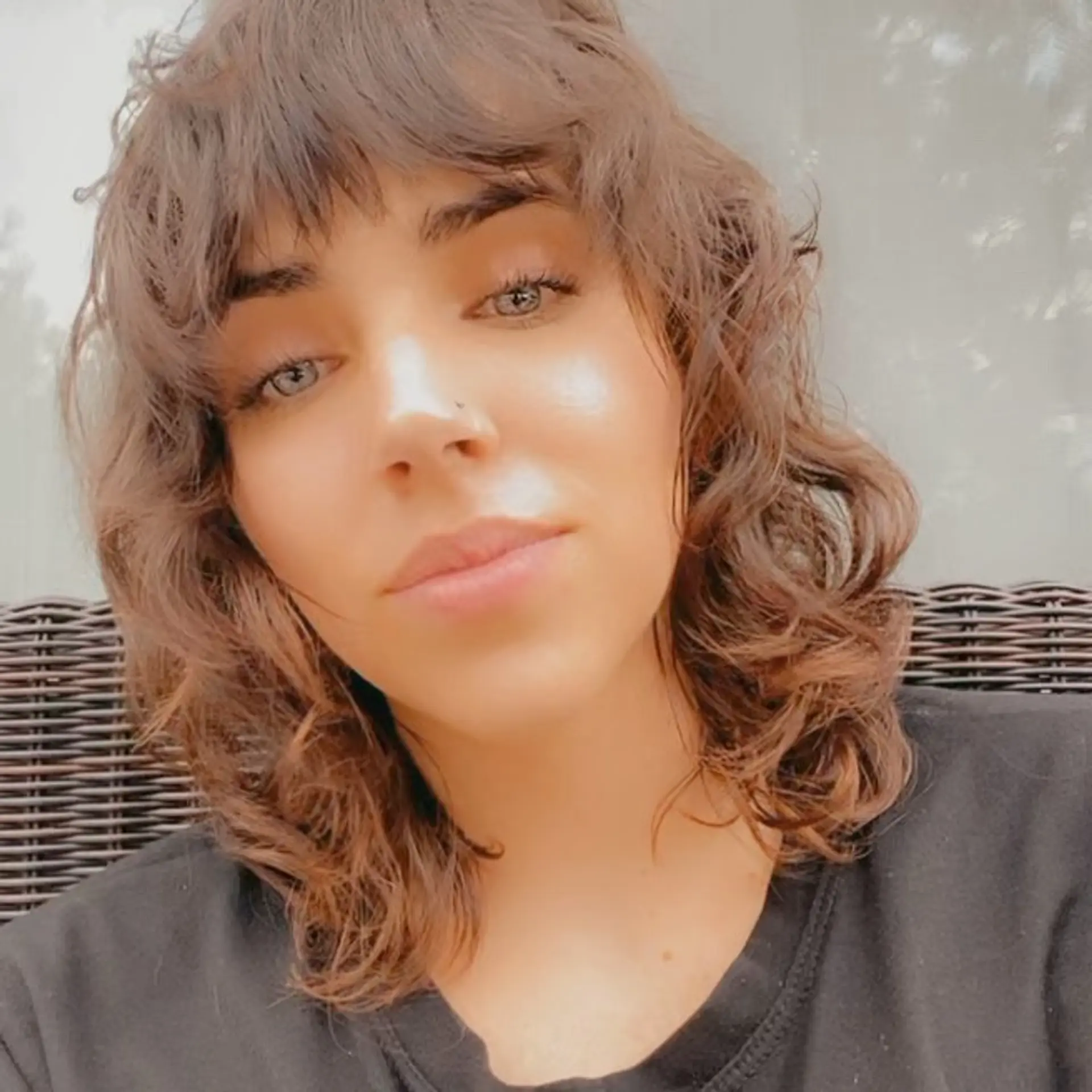 A medium-length textured shag with loose waves and full fringe bangs framing the face. 1