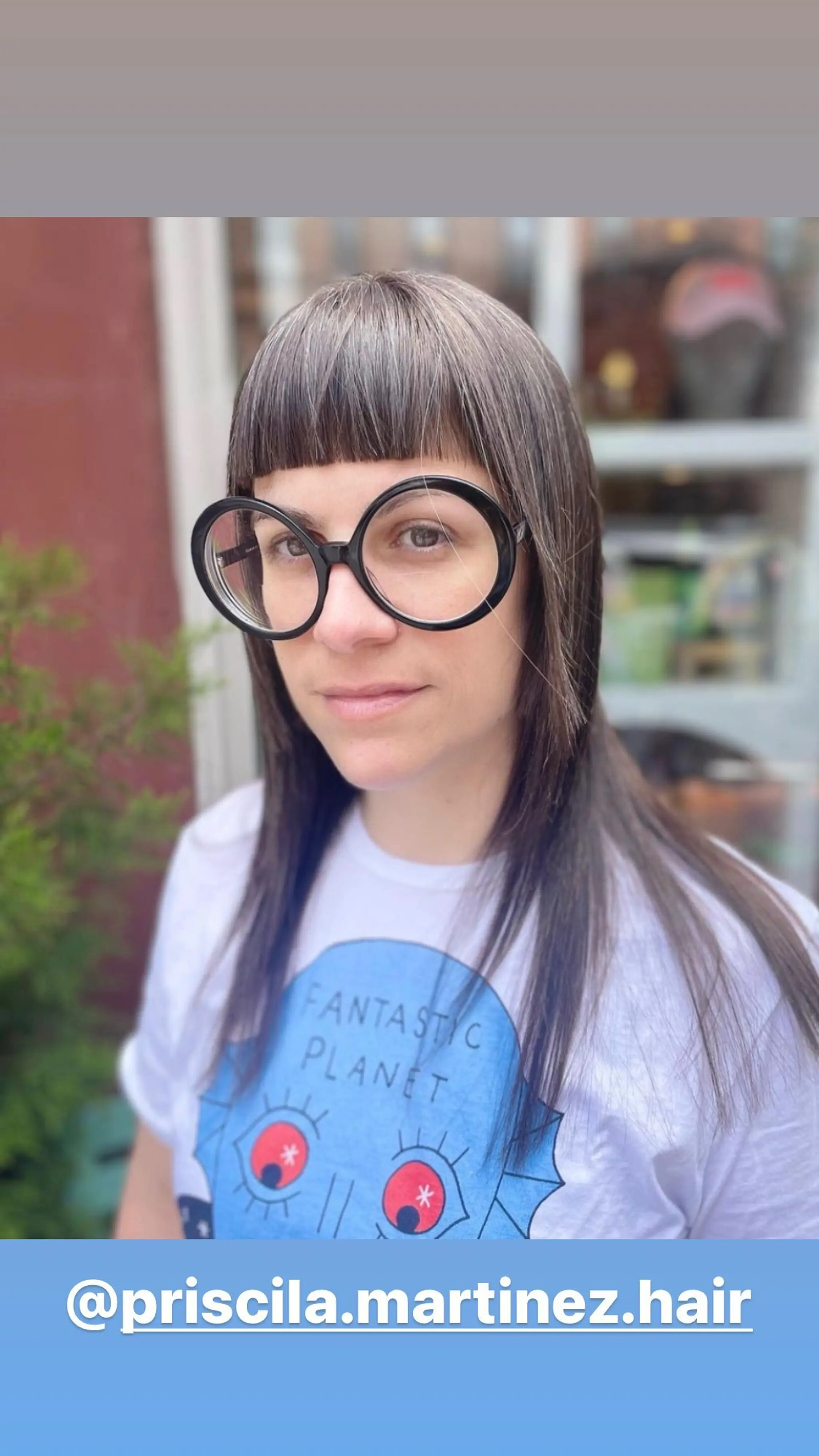 A layered shag with bold, blunt bangs.