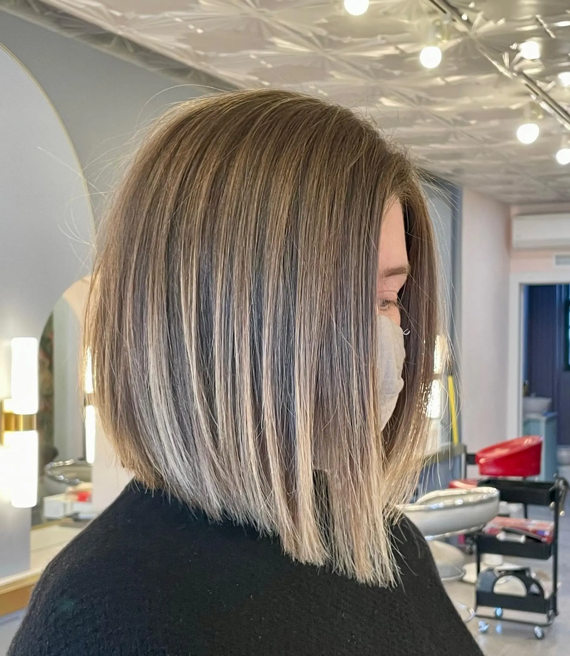 An angled bob that's longer in the front and gradually shorter in the back, with subtle layering throughout. 1