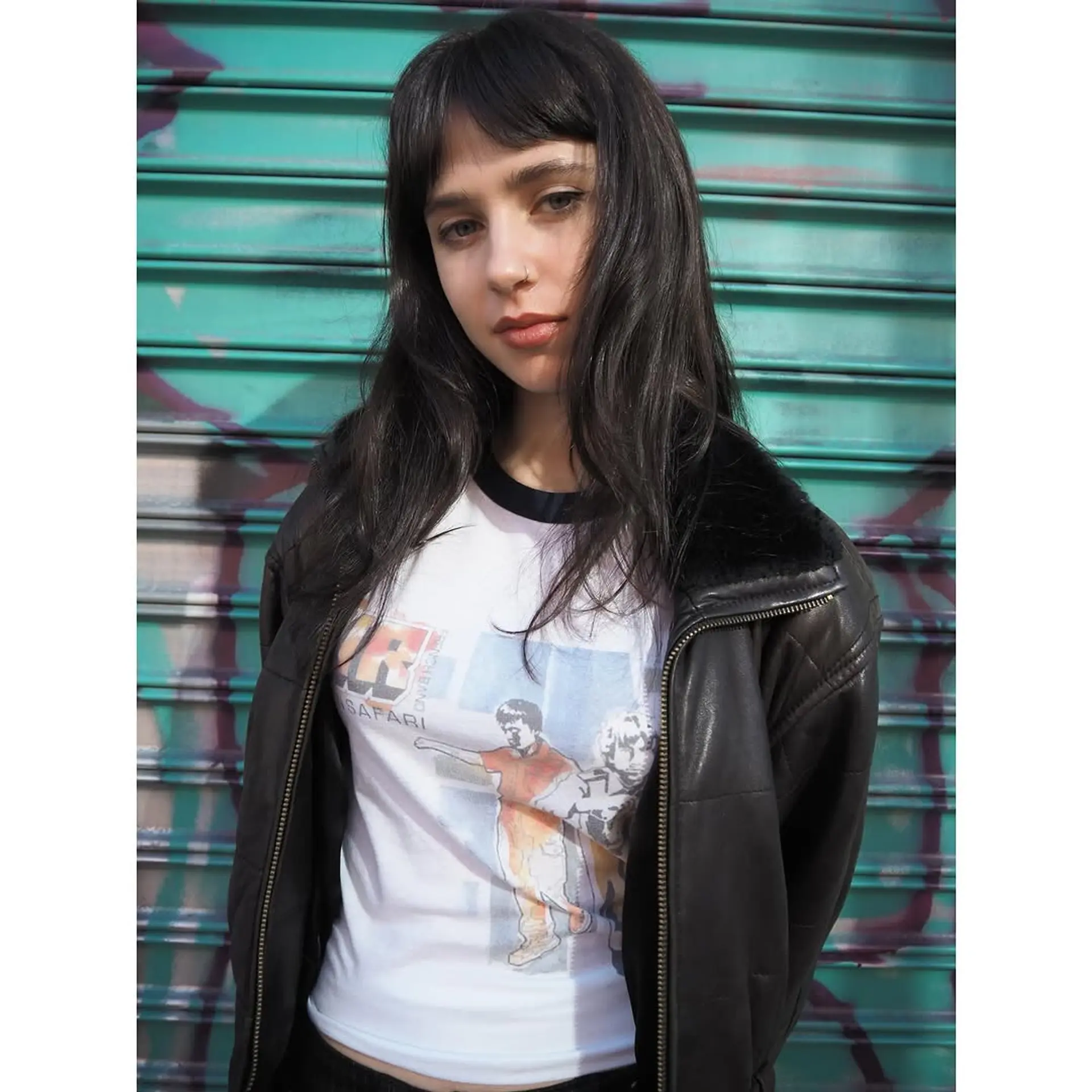 Long, straight hair with blunt bangs. 2