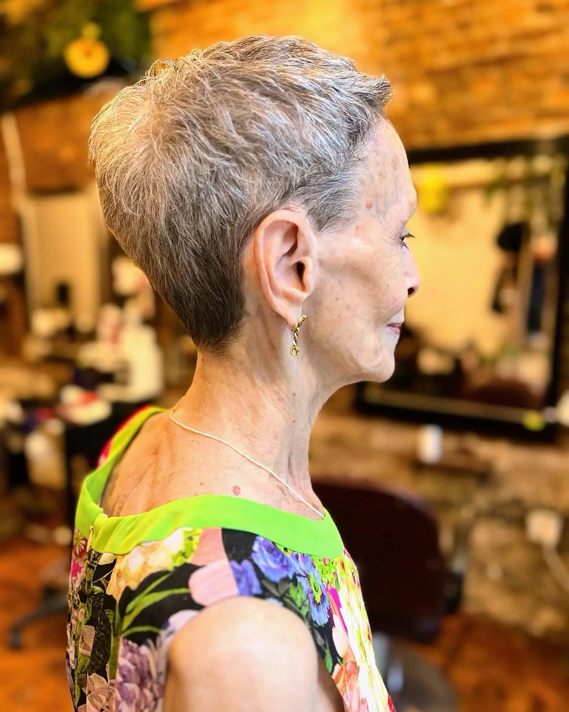 A classic, very short pixie cut with a tapered back. 1