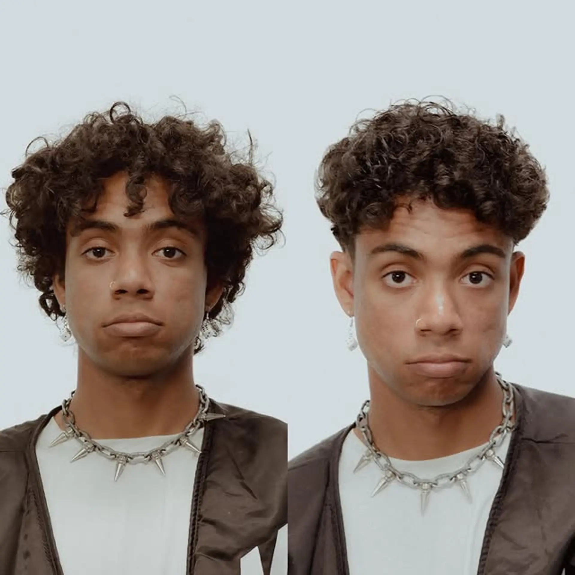 This hairstyle features short, curly hair with a tapered cut on the sides and a textured top, offering a clean and modern look. 1