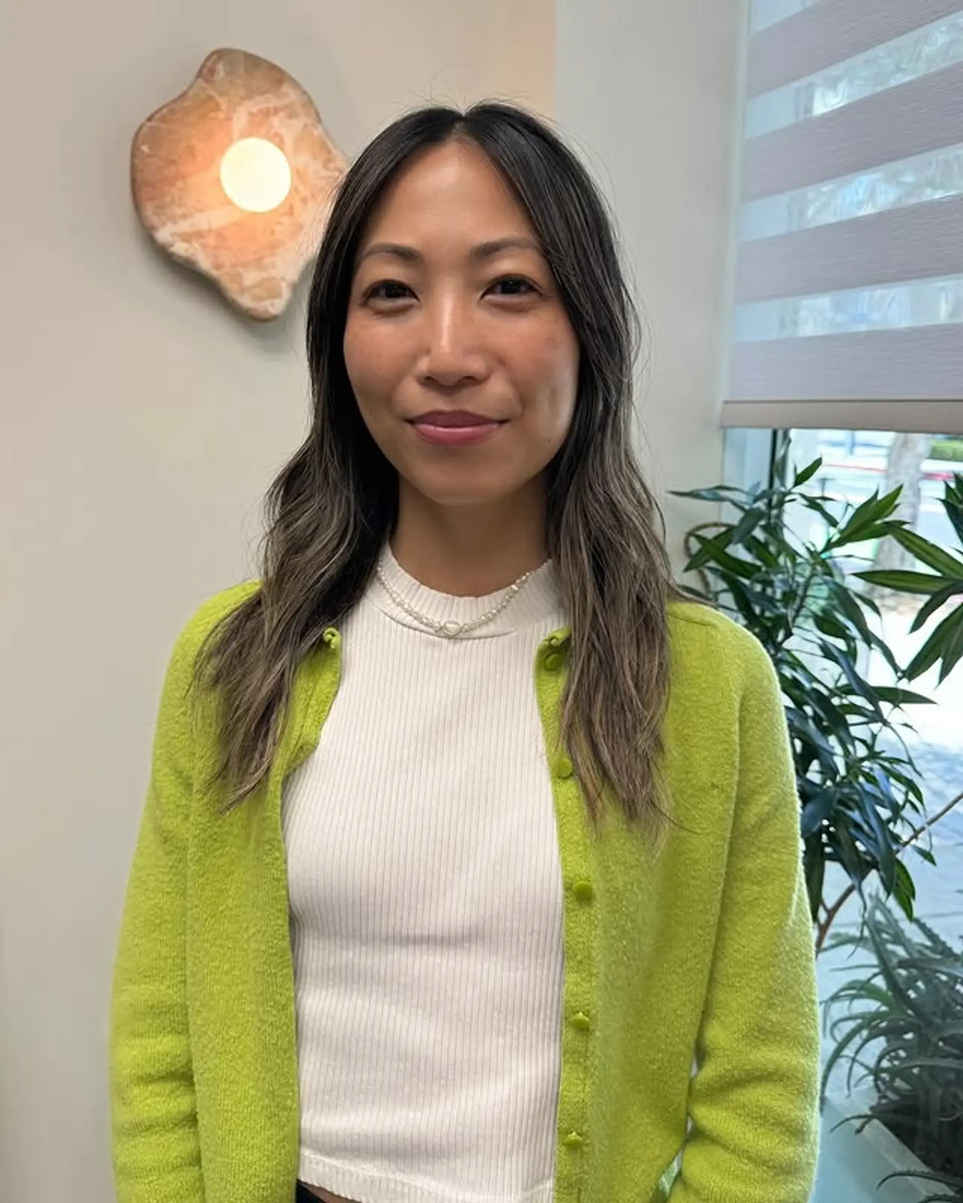 Medium length wavy sombre with blended ash blonde highlights. 1