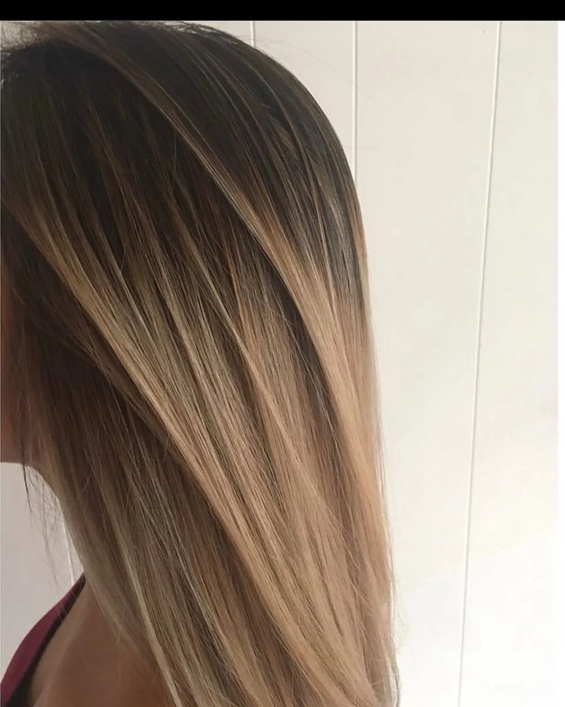 Long, sleek straight hair with a soft root shadow melting into warm honey blonde tones. 1