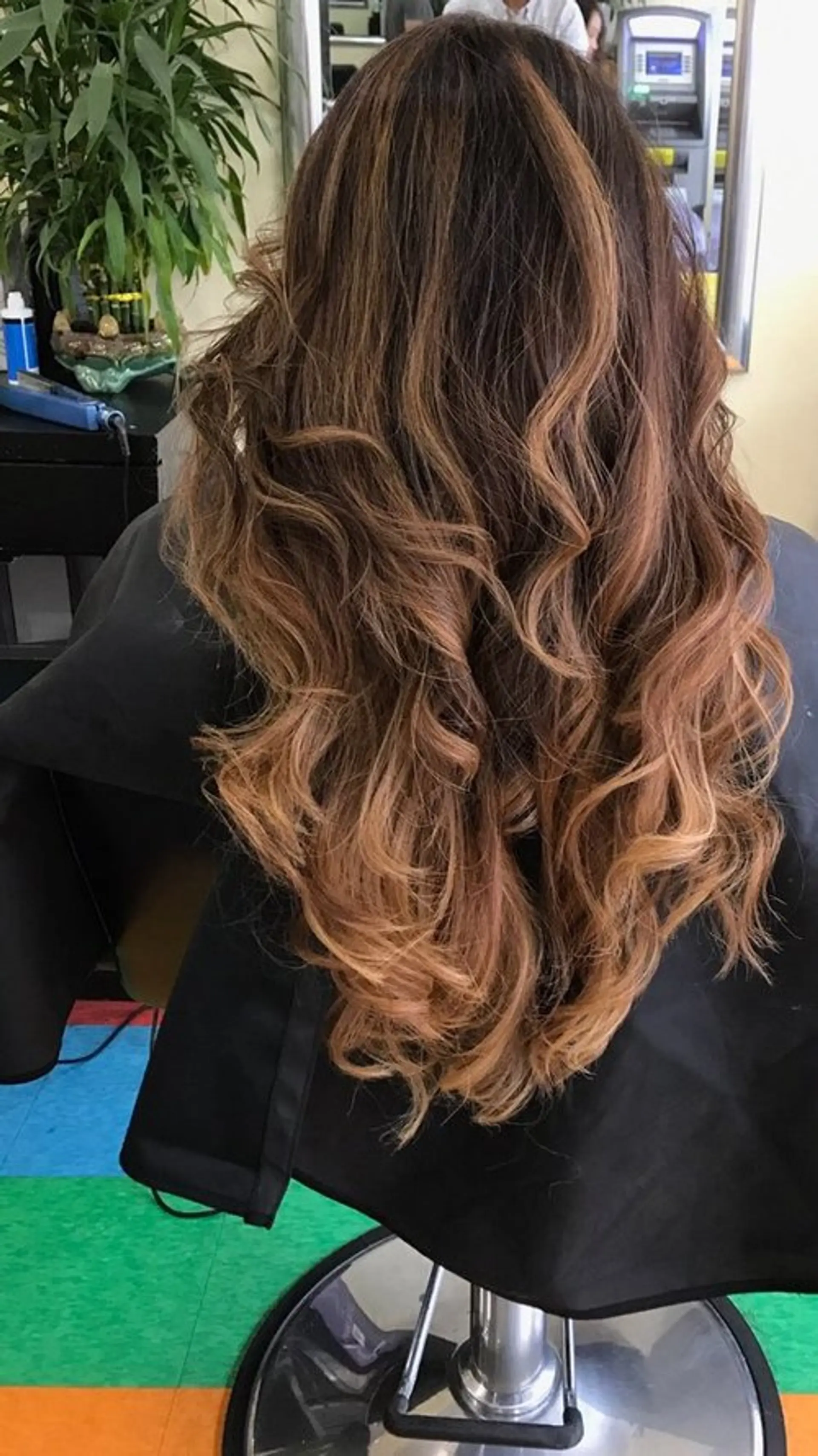 Long, wavy hair with a dimensional bronde balayage. 1
