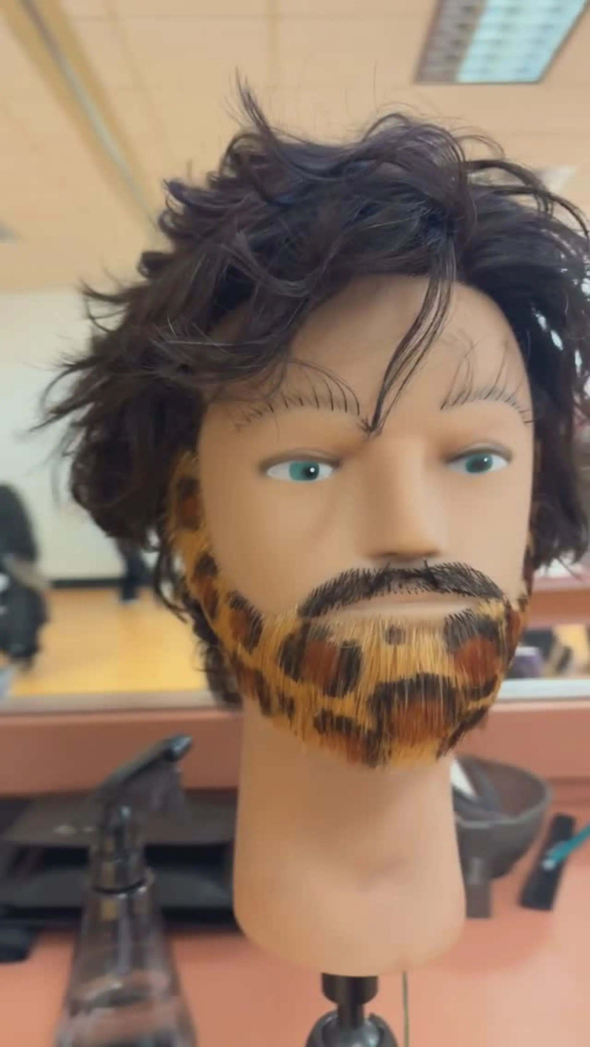 A creative leopard spot pattern dyed and detailed across a trimmed beard, accompanied by tousled dark hair. 1