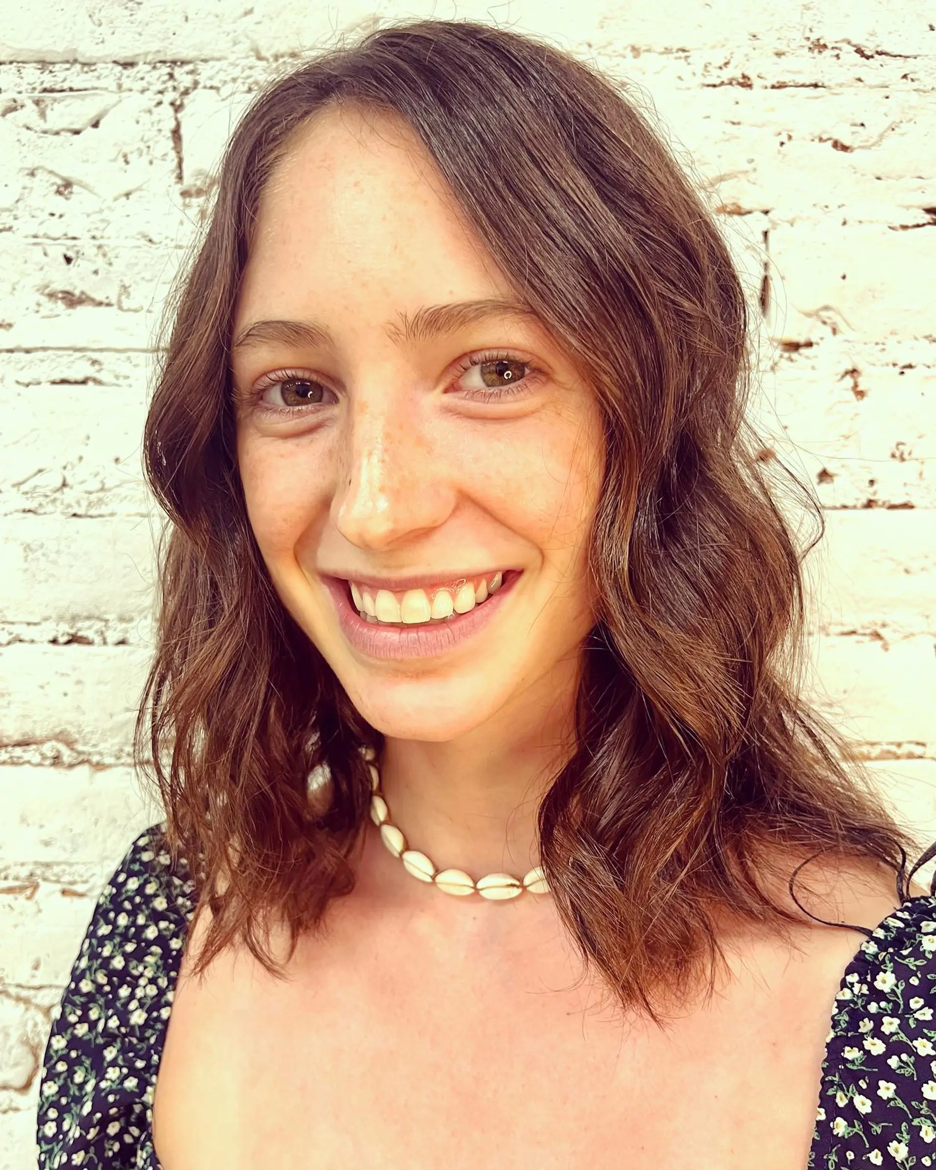 A textured medium bob resting at the collarbone, styled with soft, natural waves. 1