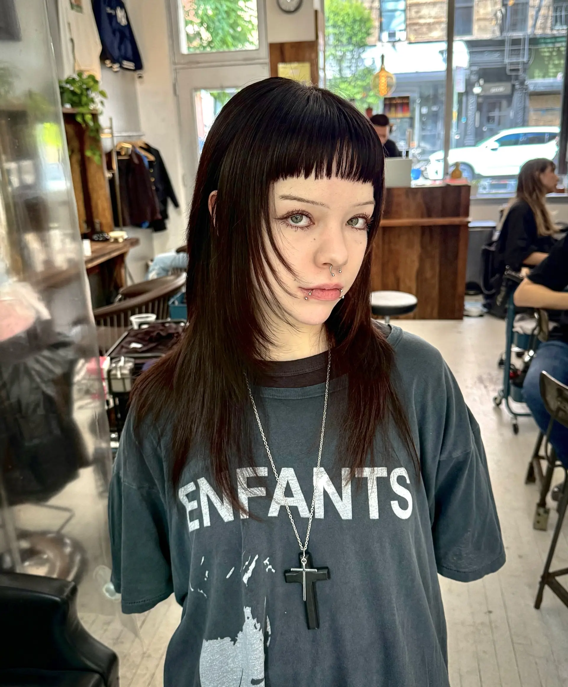 A layered shag with choppy texture and short, stylish baby bangs. 1