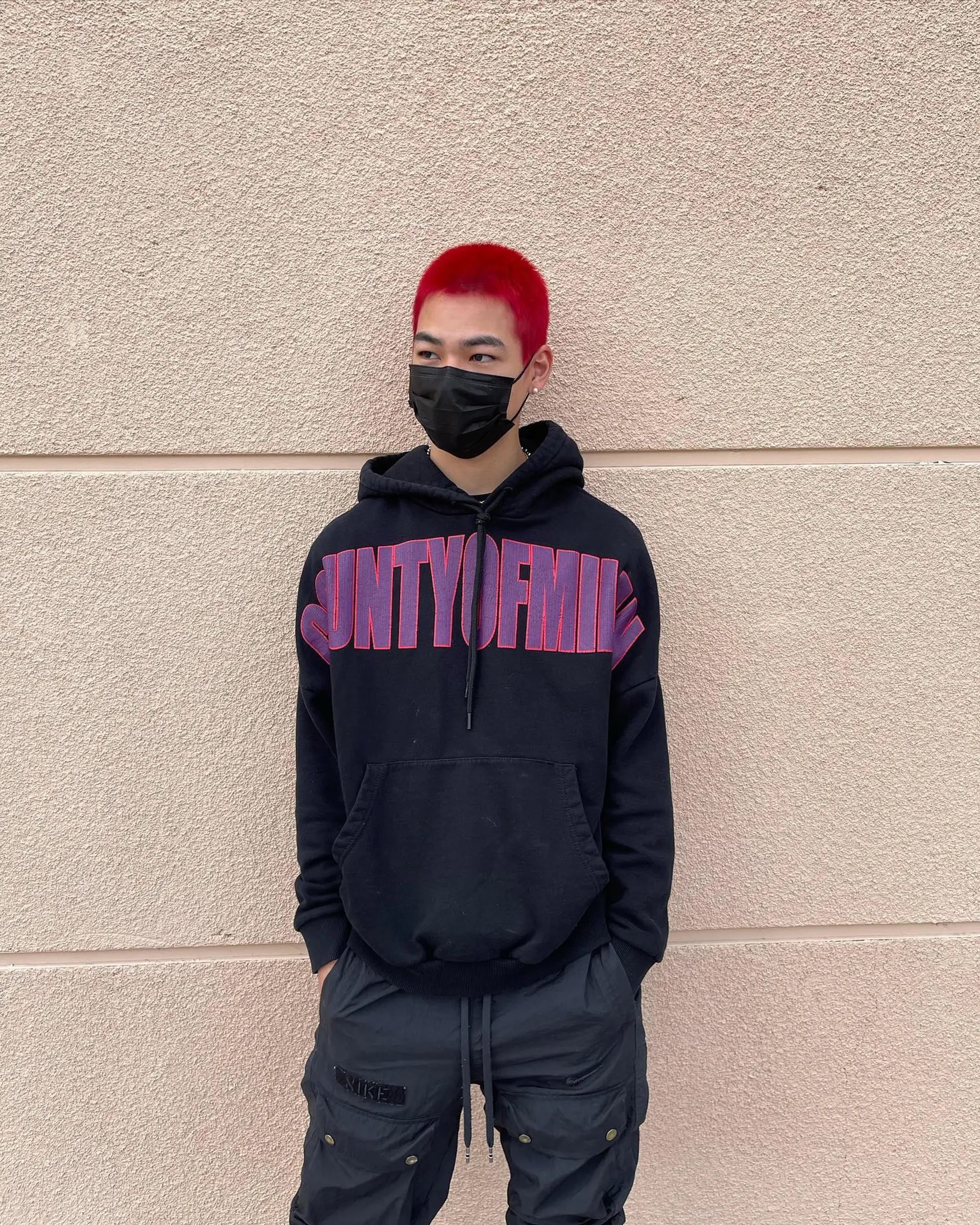 A bold, short buzz cut dyed in an intense, vibrant red hue. 1