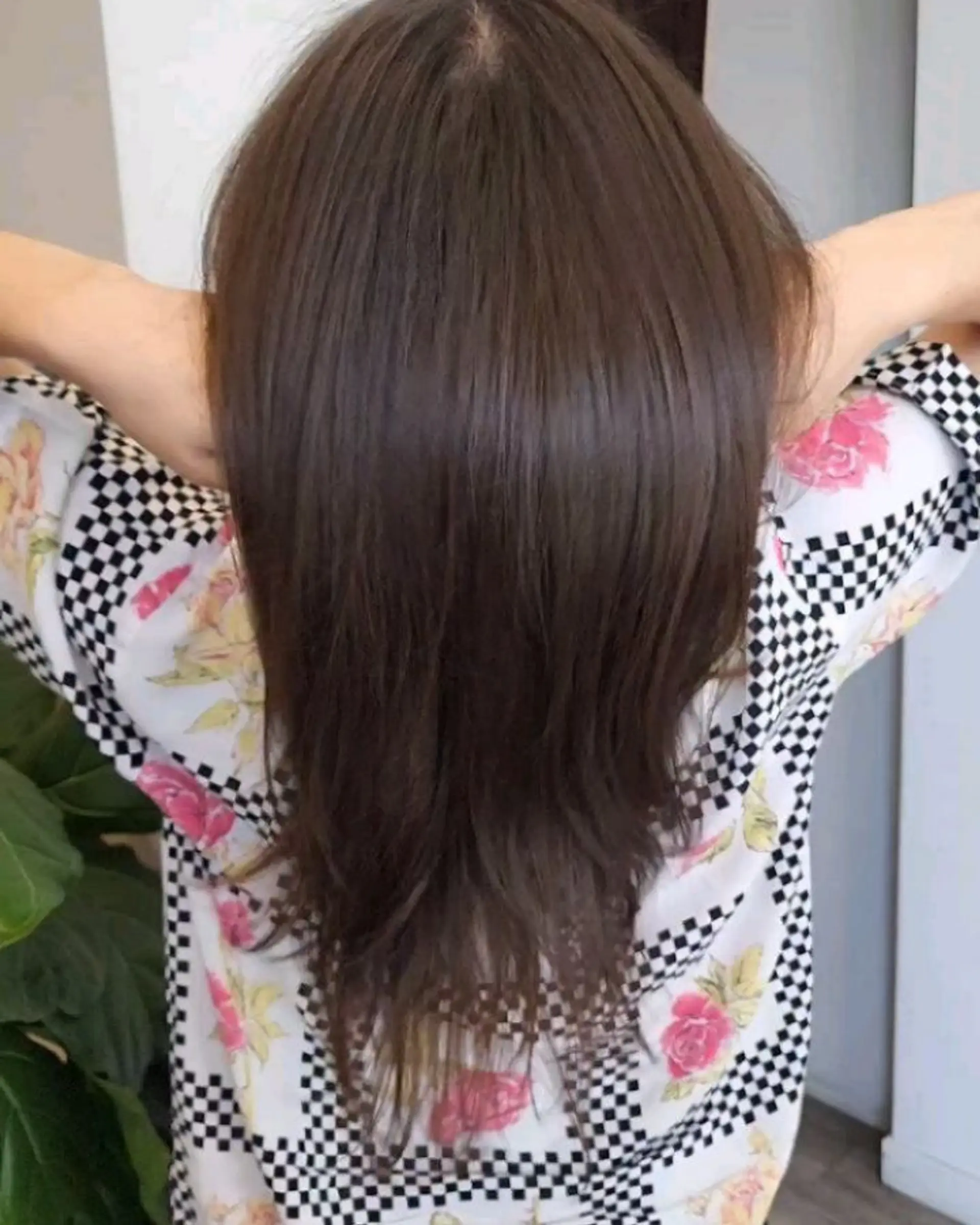 Medium-to-long brunette hair cut into a soft U-shape with seamless flowing layers. 1