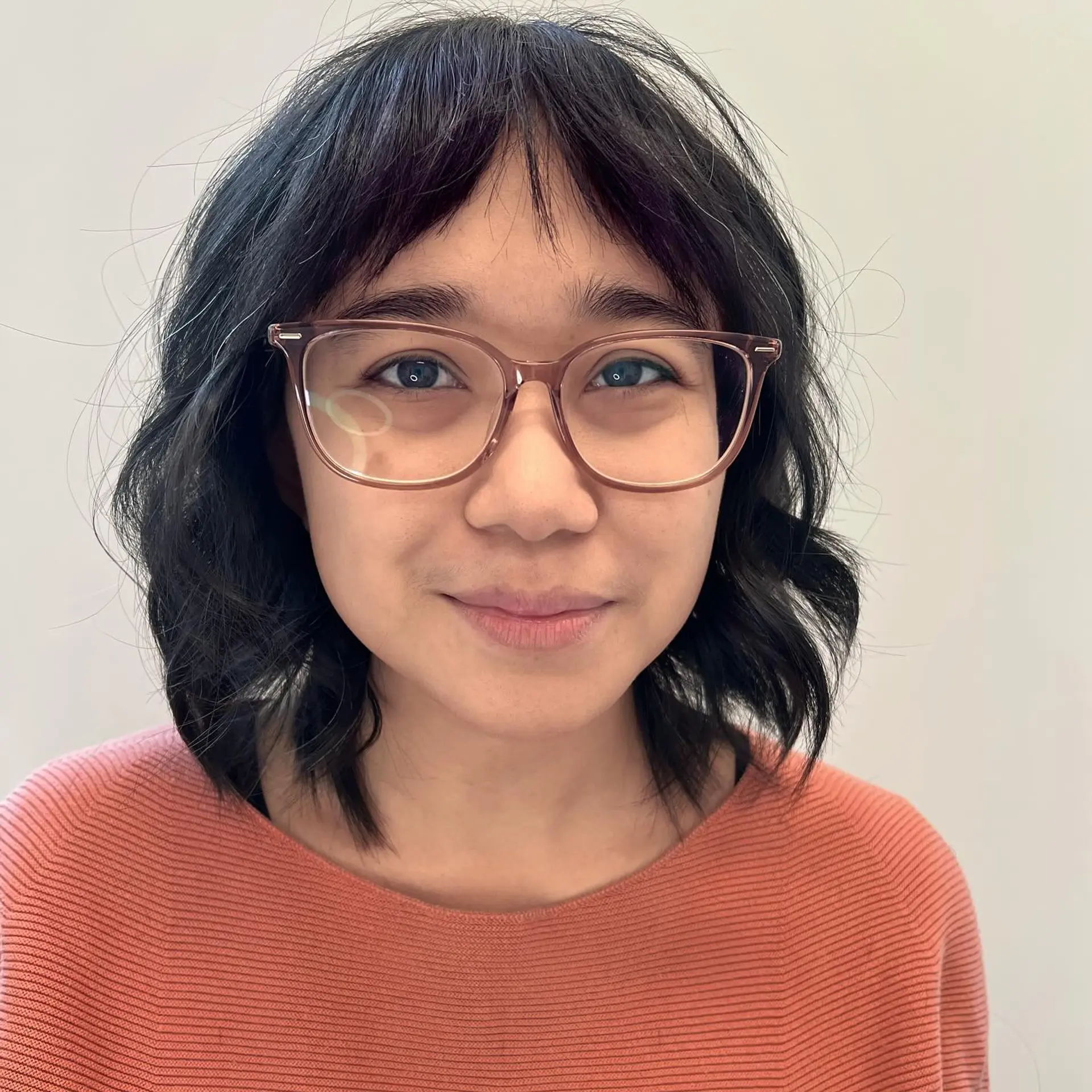 A textured collar-length lob cut with soft bends and light, piecey fringe across the forehead. 1