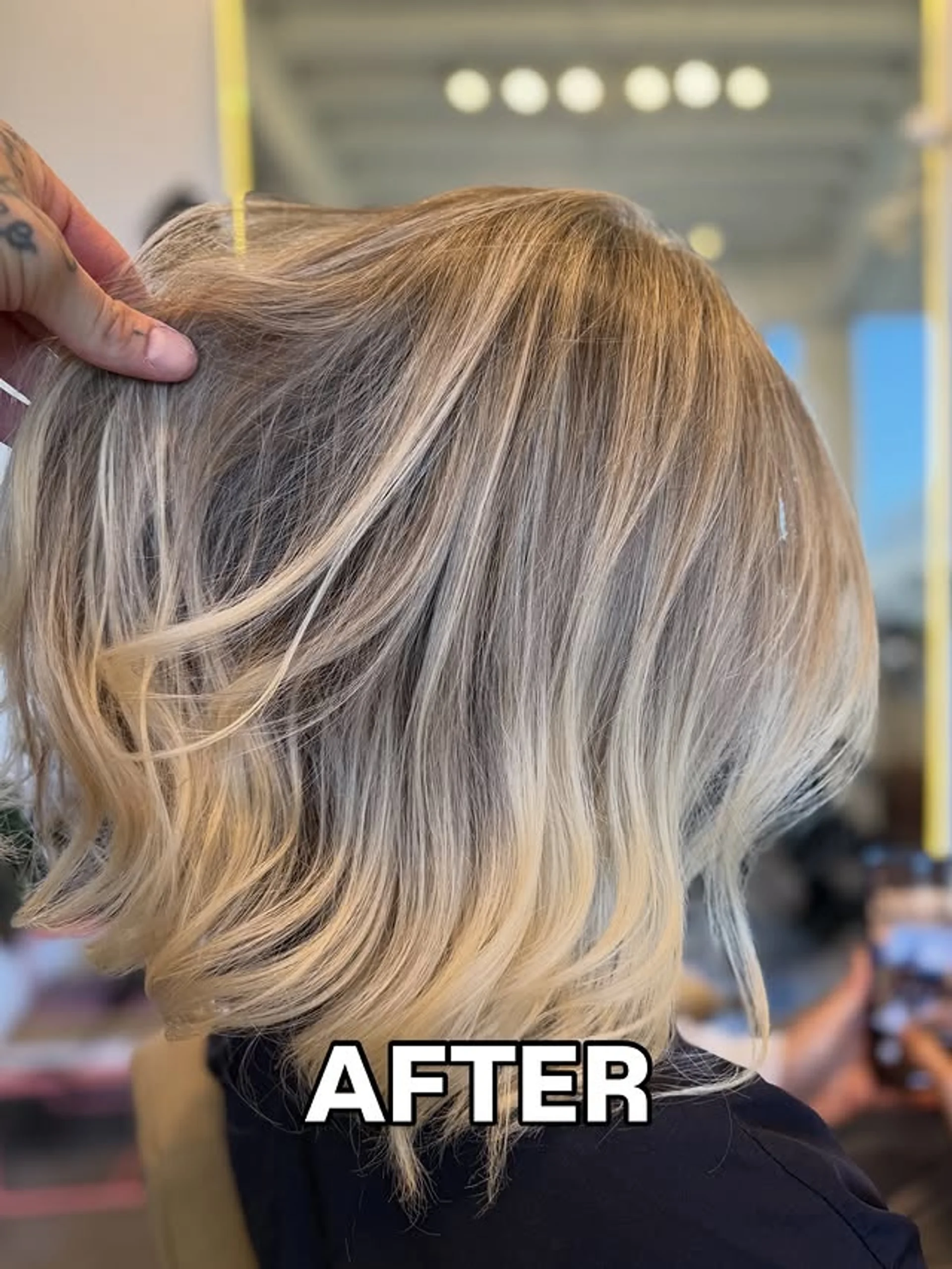 A short, voluminous bob haircut with a side part and soft, bouncy waves on dark hair. - Preview 3