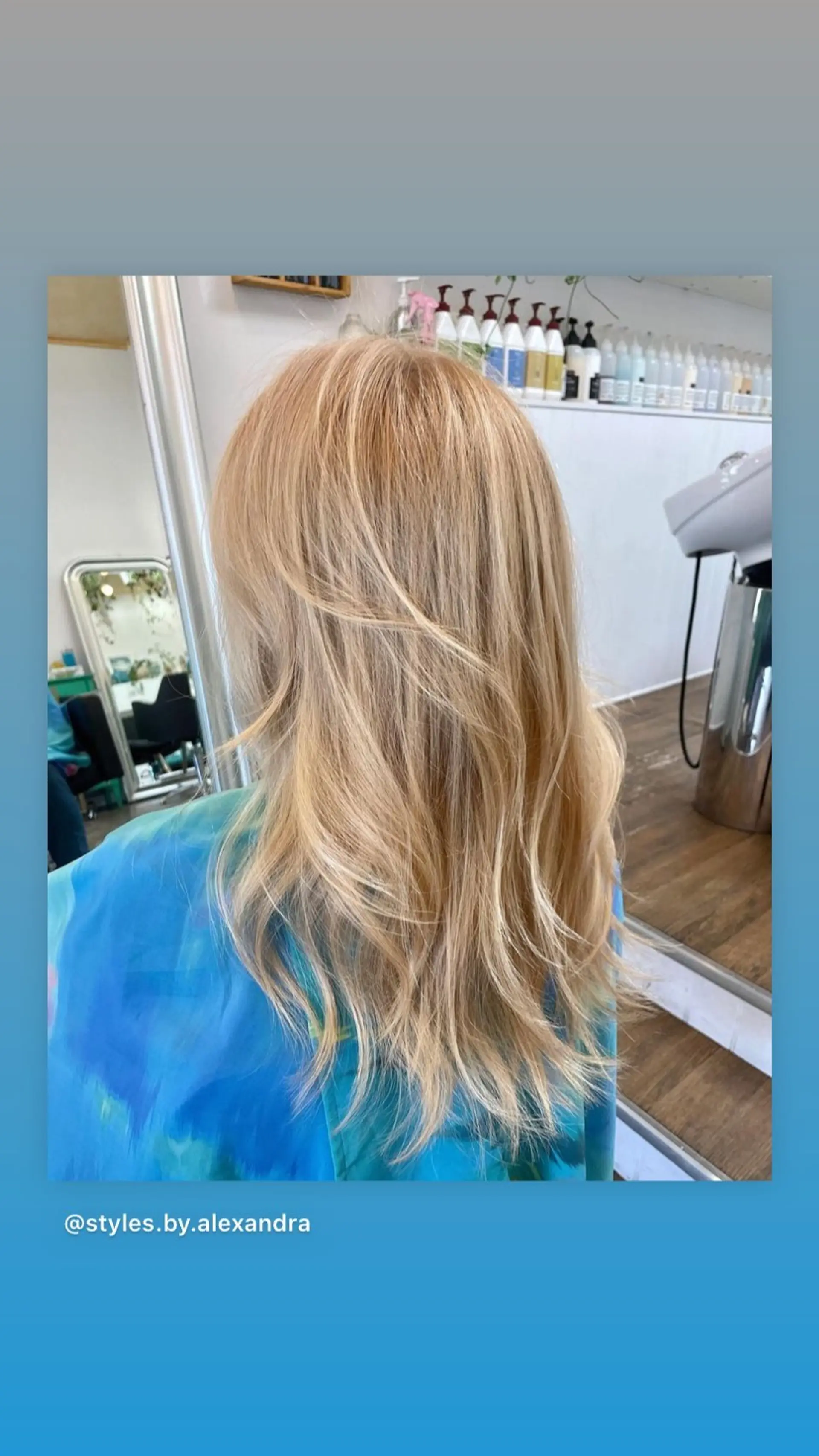 A medium-length layered haircut with subtle beachy waves. 1