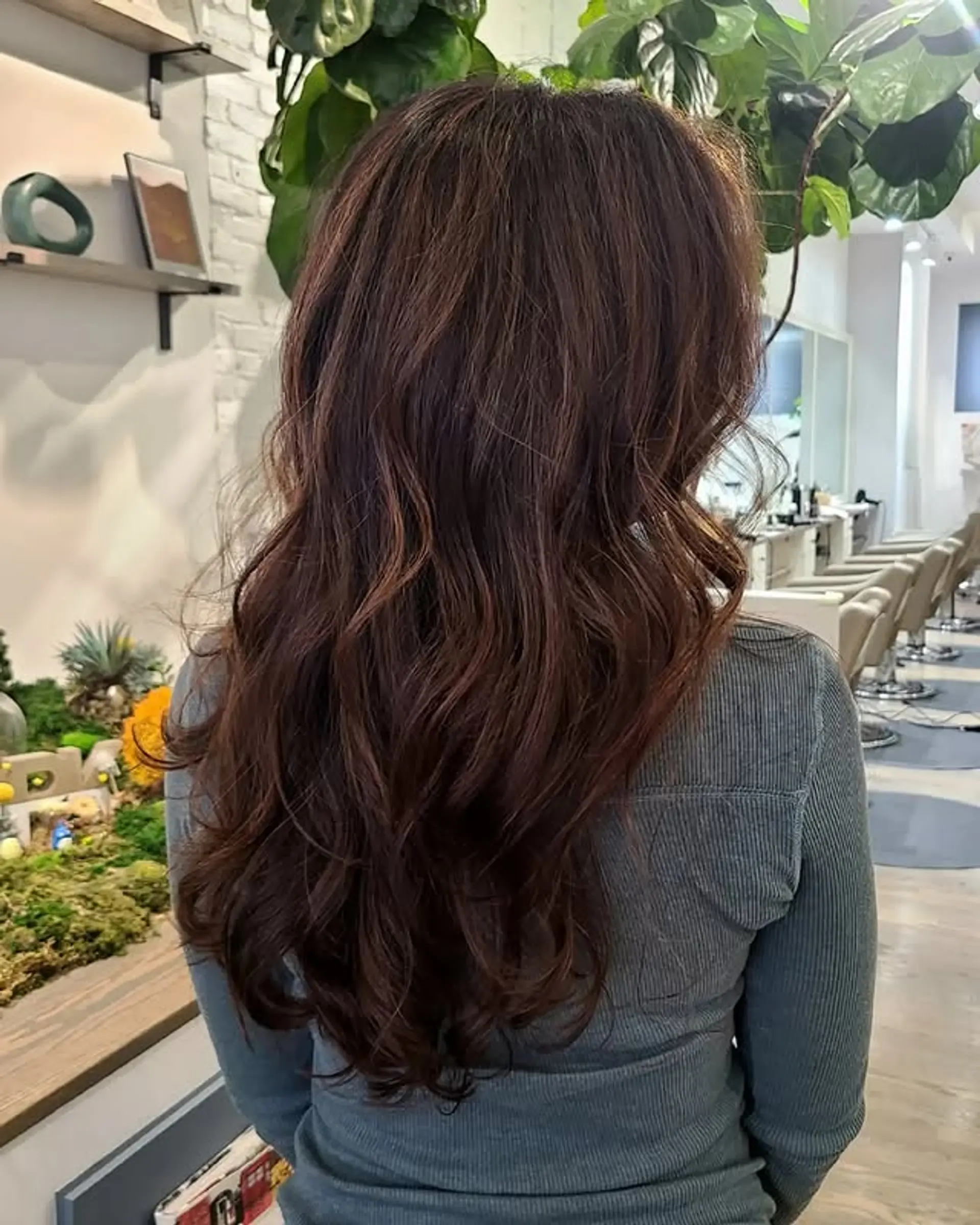 A long, wavy hairstyle with a beautiful auburn balayage. 1