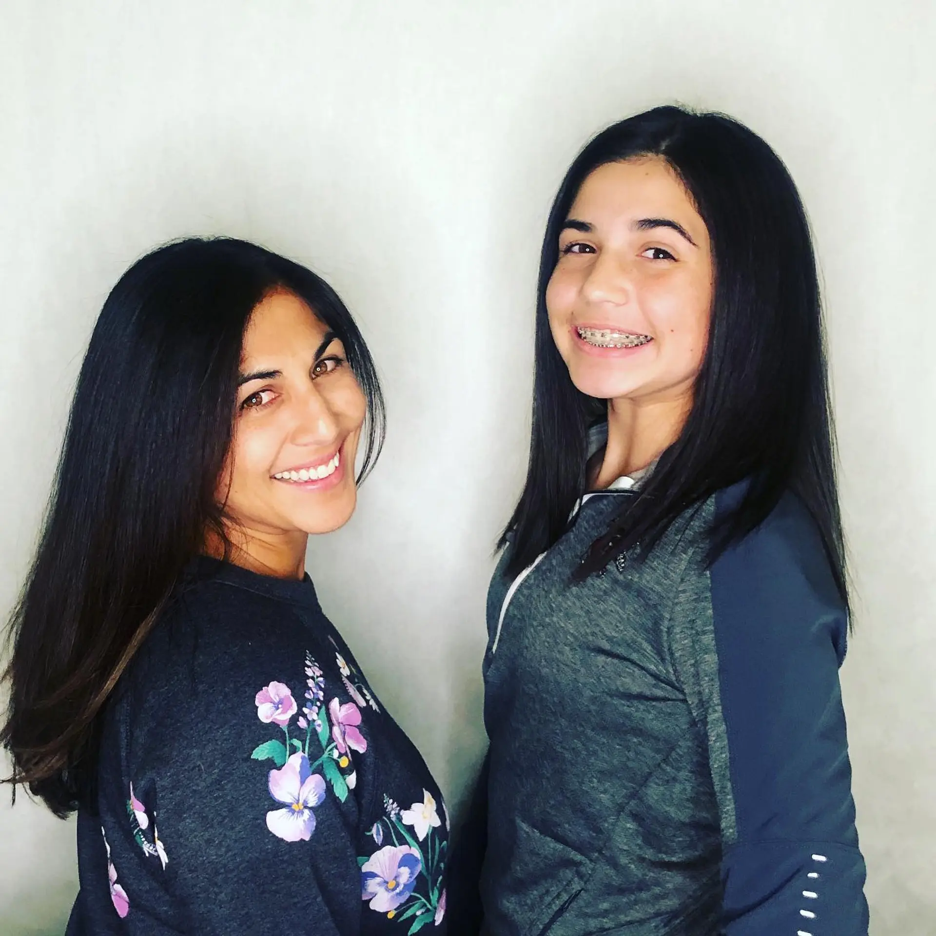 Sleek, smooth dark hair styled straight with a polished, shiny finish. 1