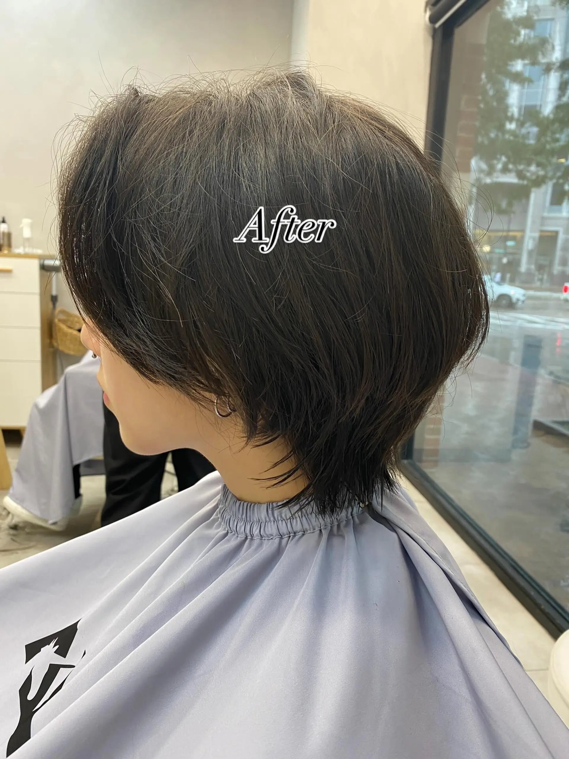A textured short bixie cut featuring soft, wispy layers at the nape, rounded volume at the crown, and ear-framing pieces. 1