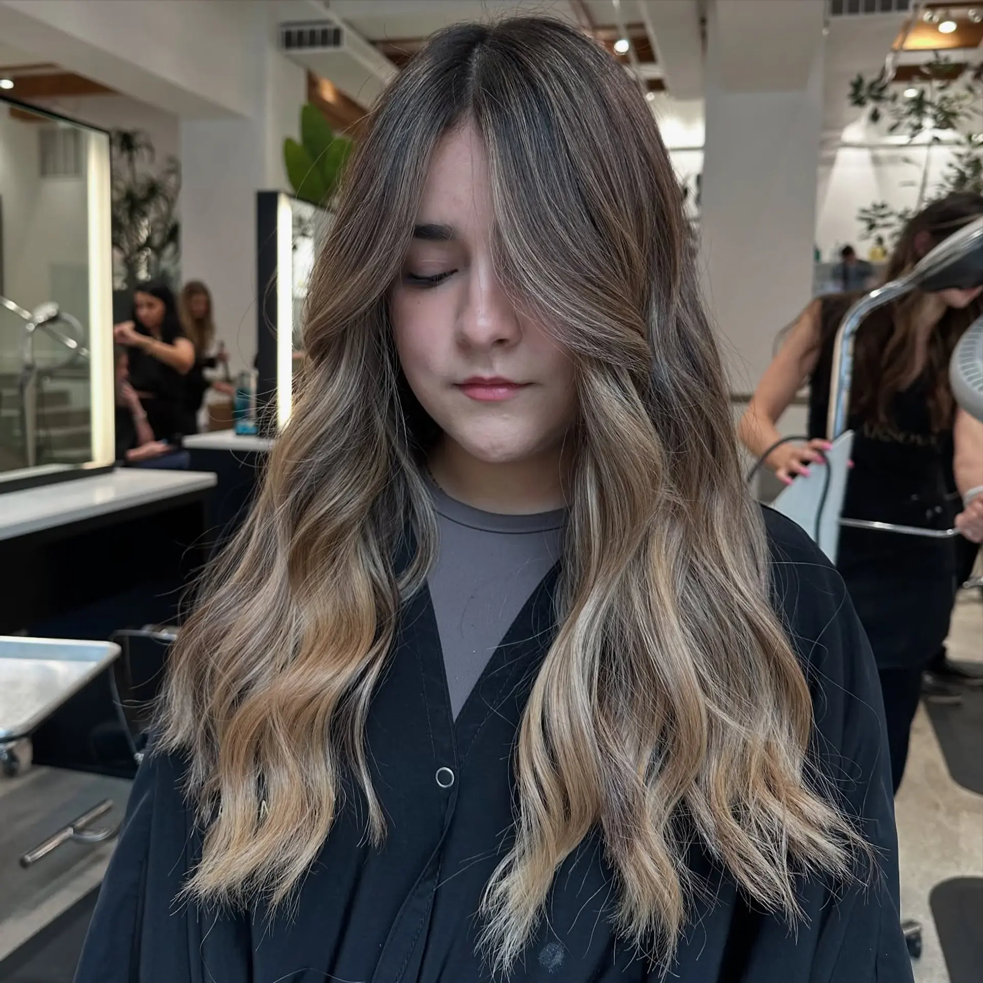 Long, wavy hair with a caramel blonde balayage. 2