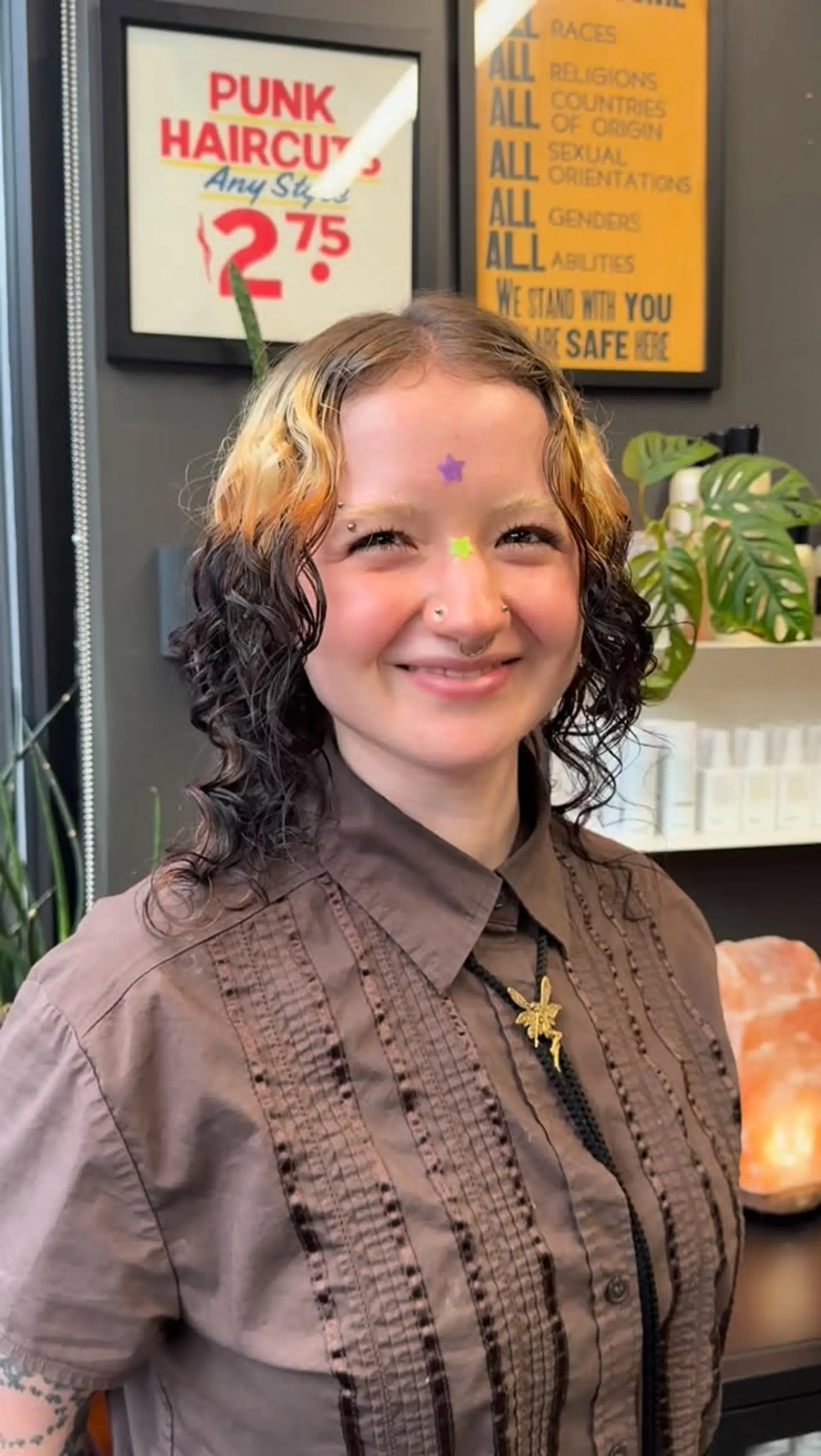 Medium-length defined curly style featuring high-contrast color blocking with warm golden-blonde crown and face-framing sections over rich dark brown curls. 1