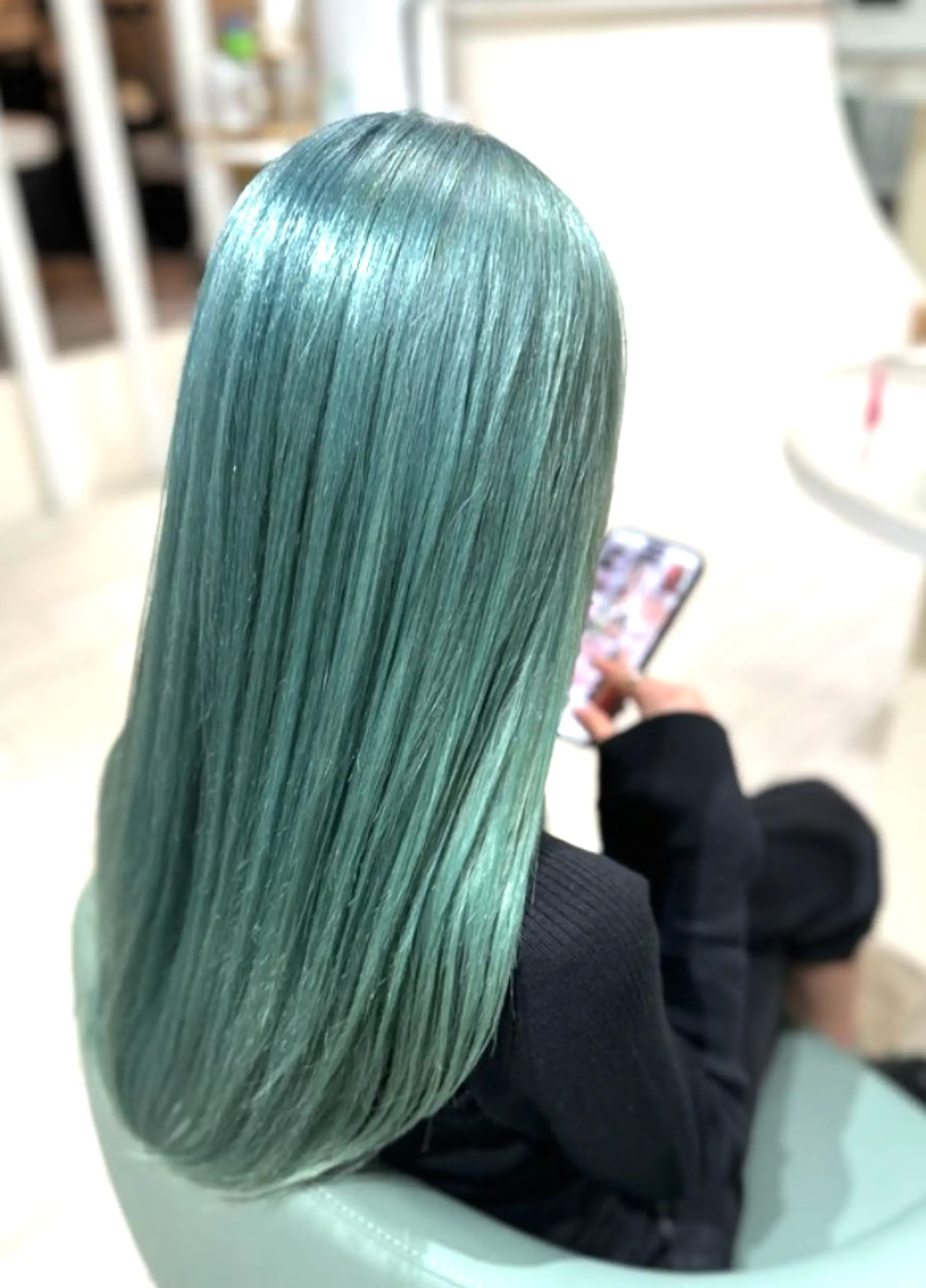 Long, straight, and sleek mint green hair, silky smooth and vibrant, flowing seamlessly down the back with a modern and bold touch. 1